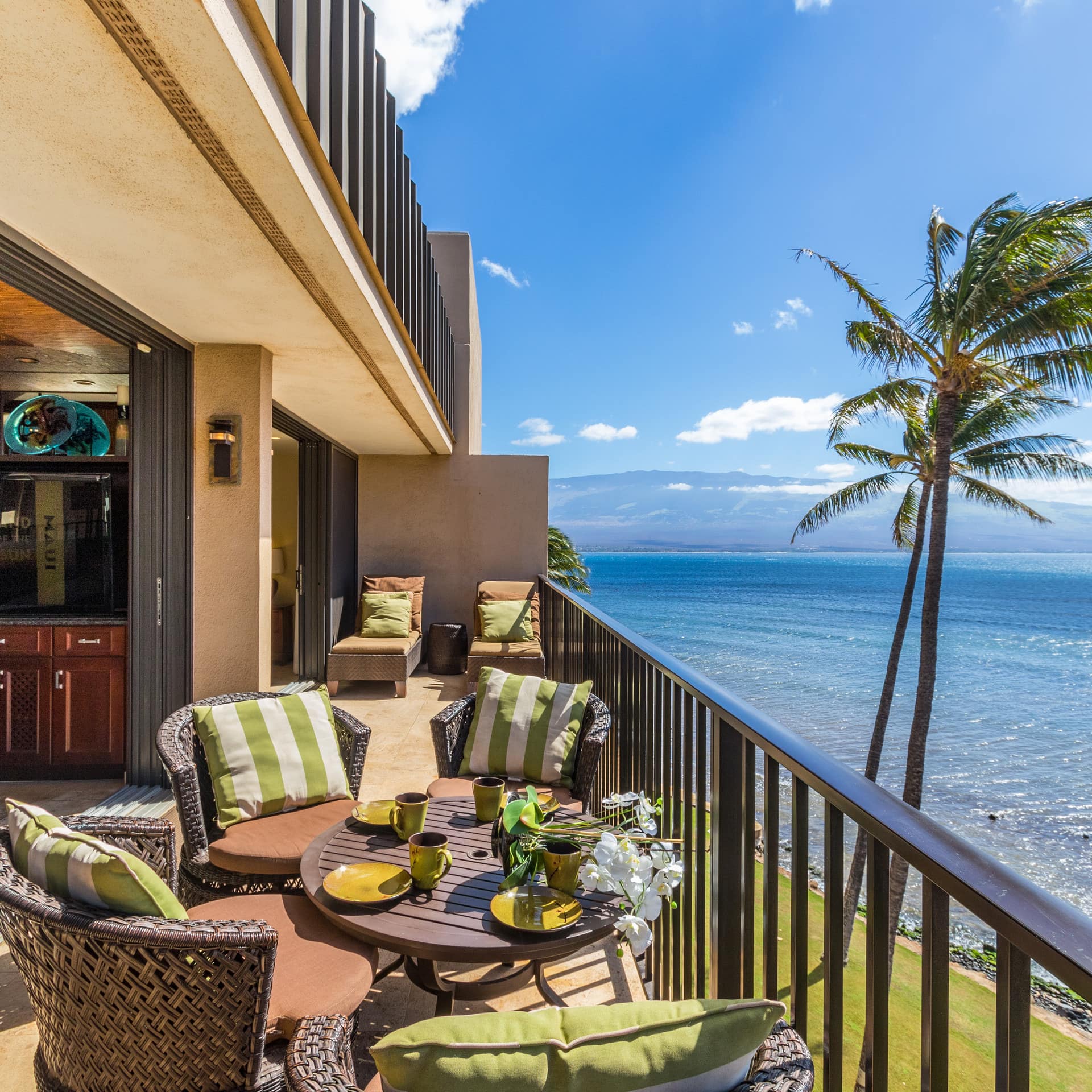 Oceanfront condo with sun deck and outdoor furniture in Maui, Hawaii