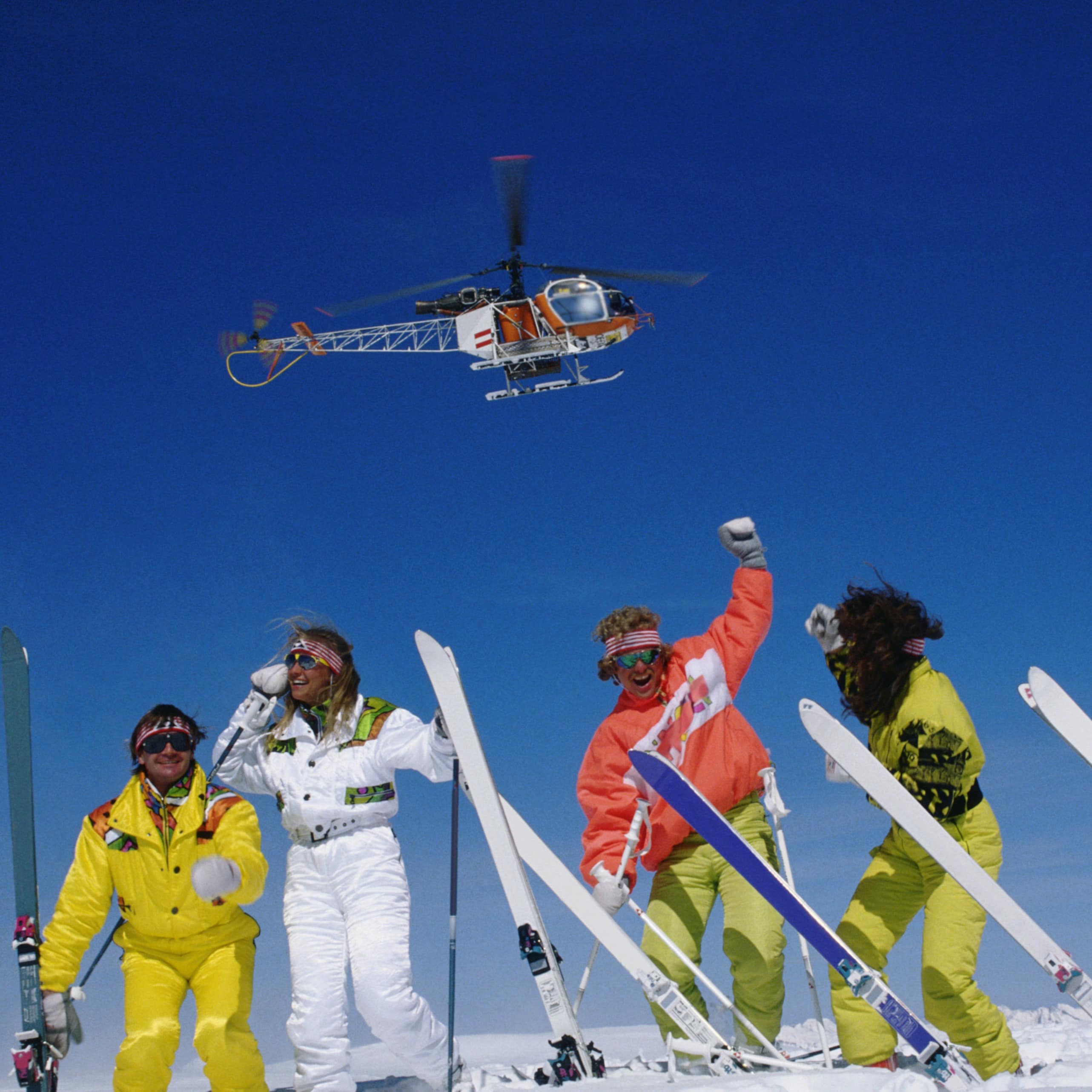 Skiers cheering after heli skiing 