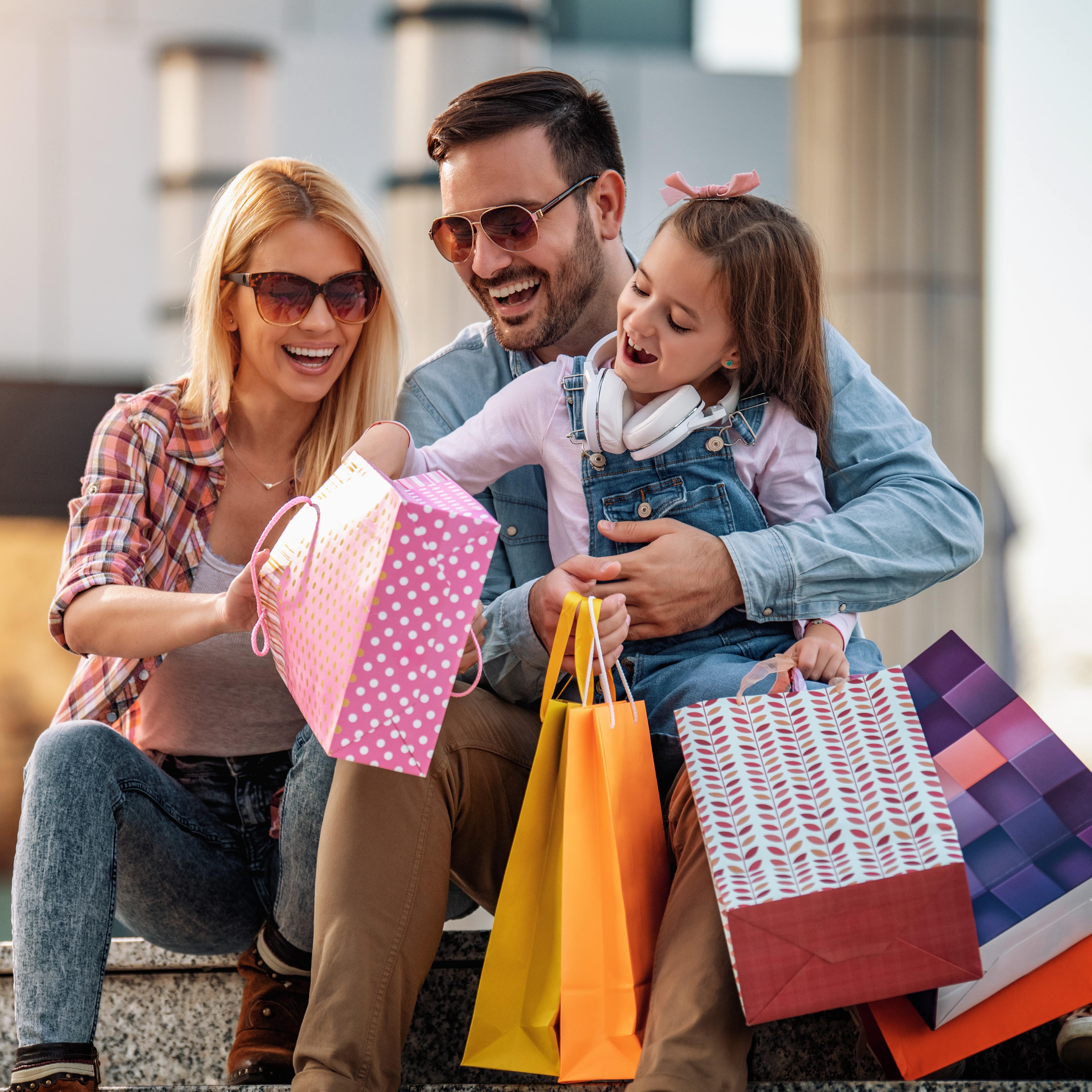 Family with shopping bags