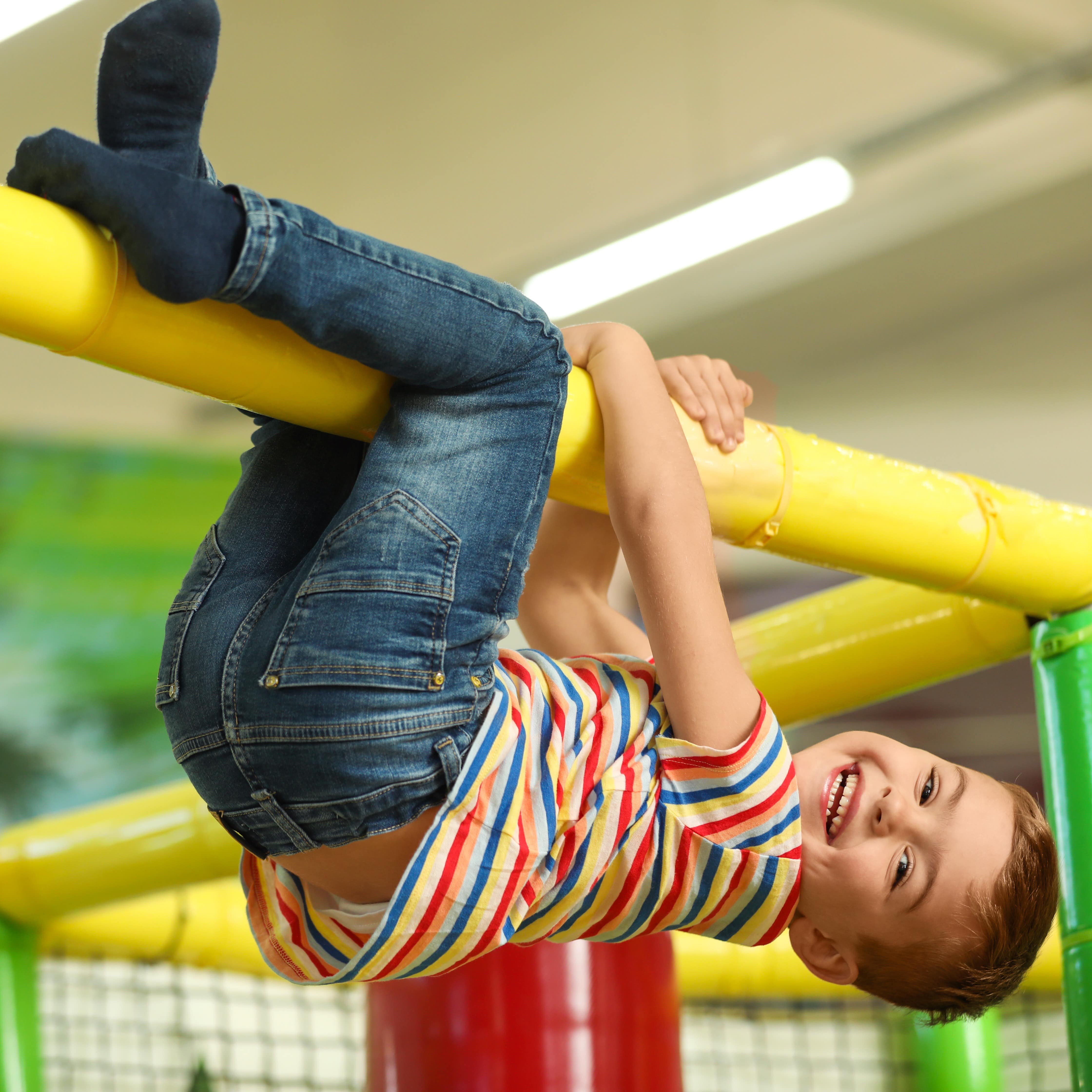 Little boy playing in play area