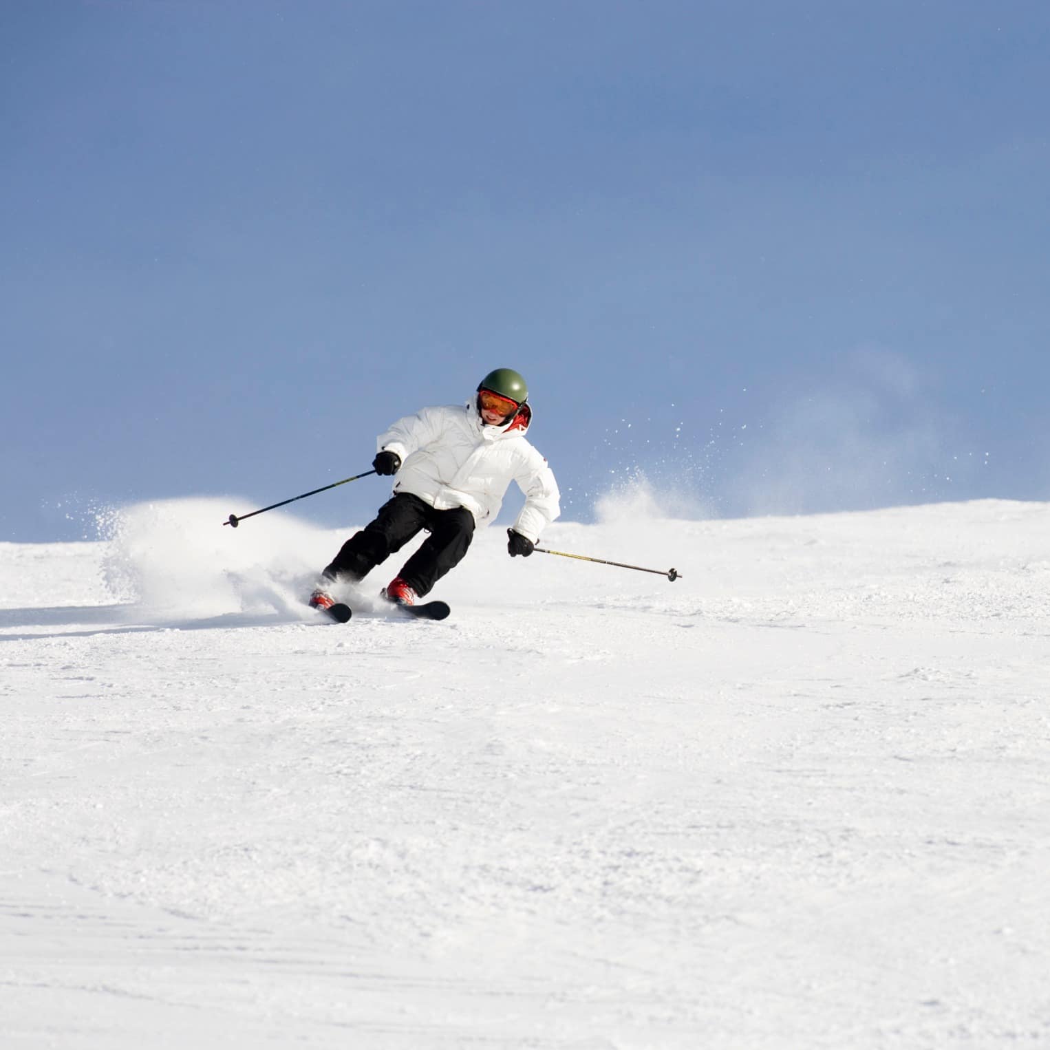 Skier skiing down a snow-covered slope