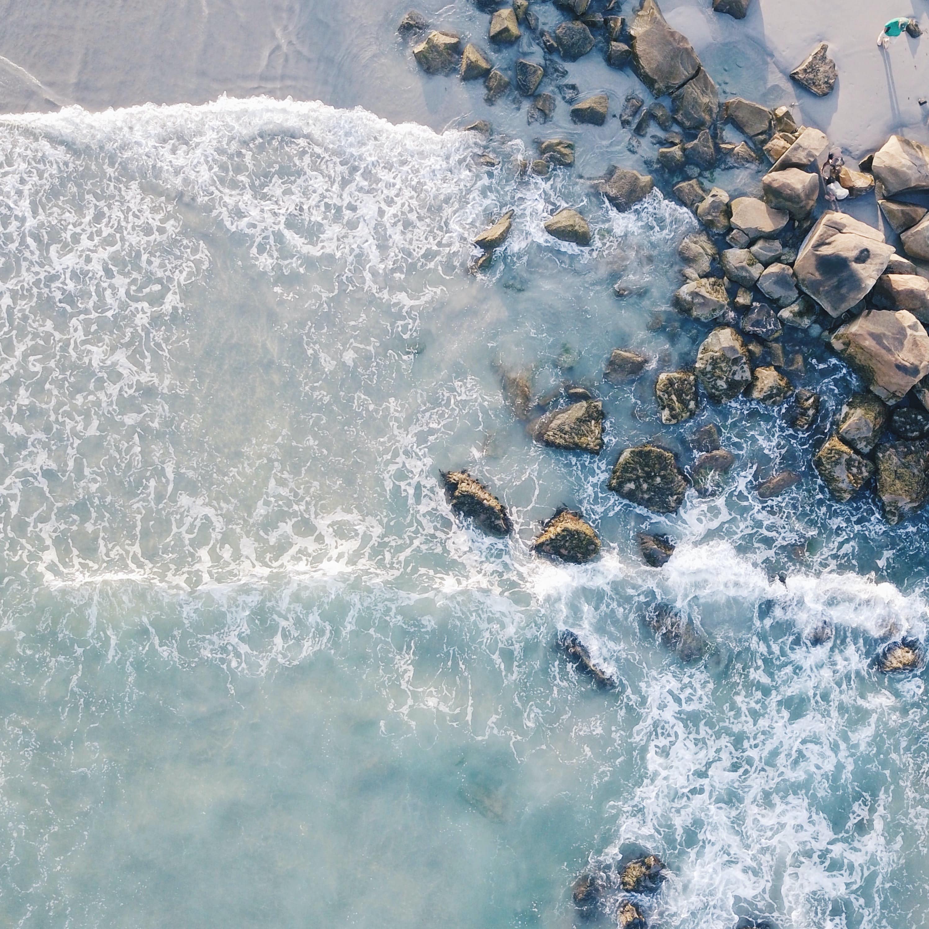 White sand beach and clear pale waters of a rocky beach of Nova Scotia