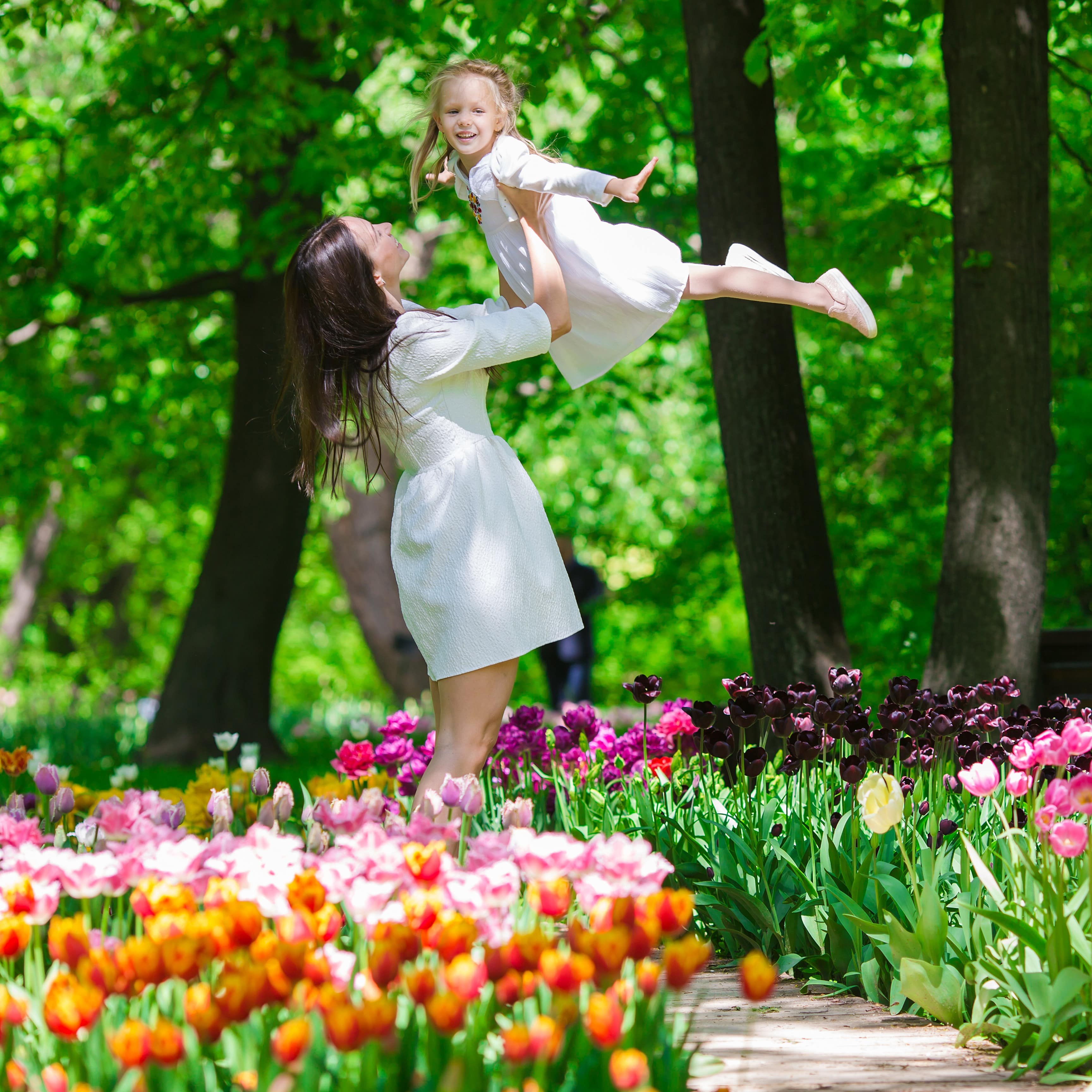 Mother and daughter in tulip garden