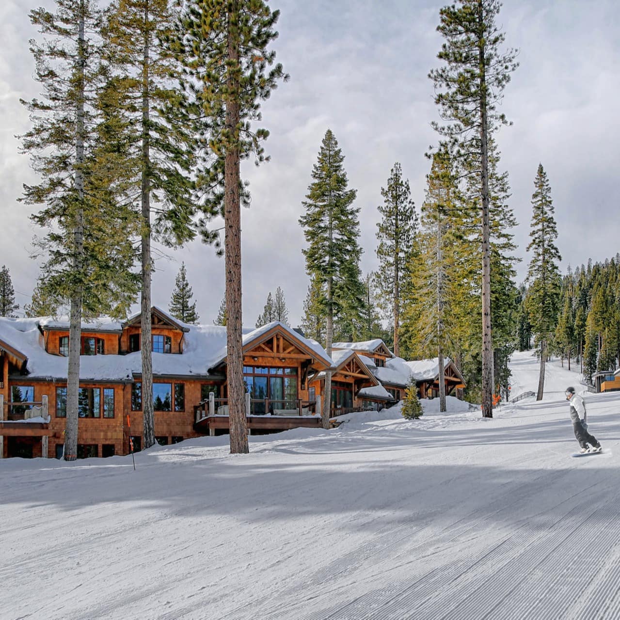 Personal access to the slopes with a view of a snow-covered lodge