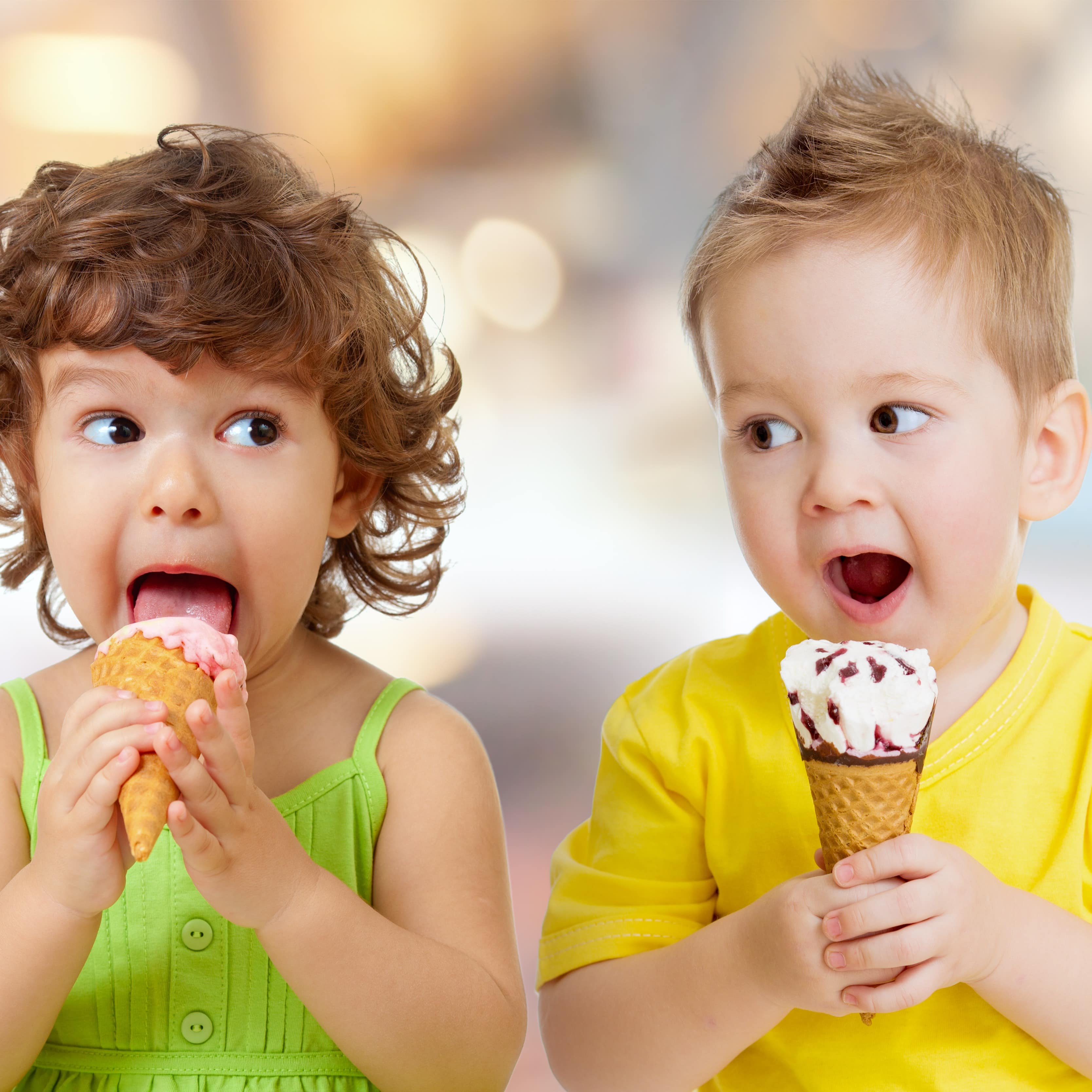 Little boy and girl eating ice cream
