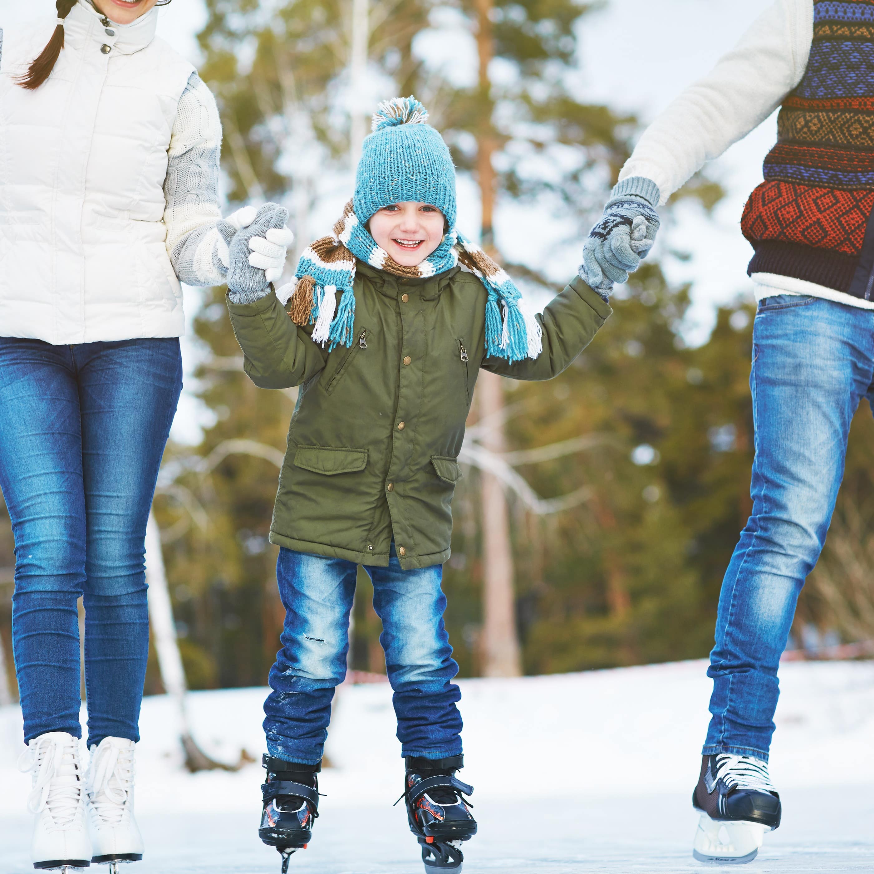 Family ice skating outdoors
