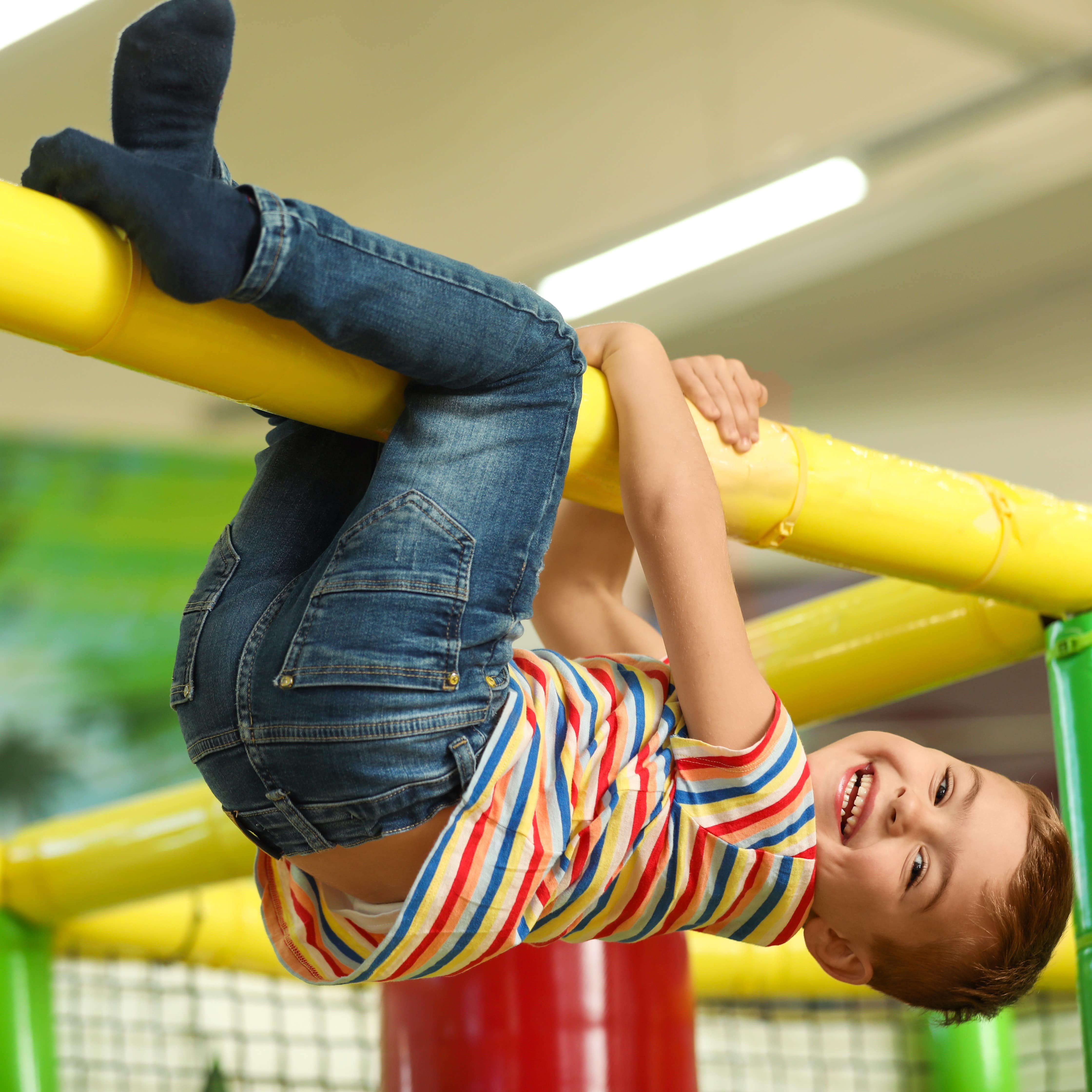 Little boy playing on indoor playground