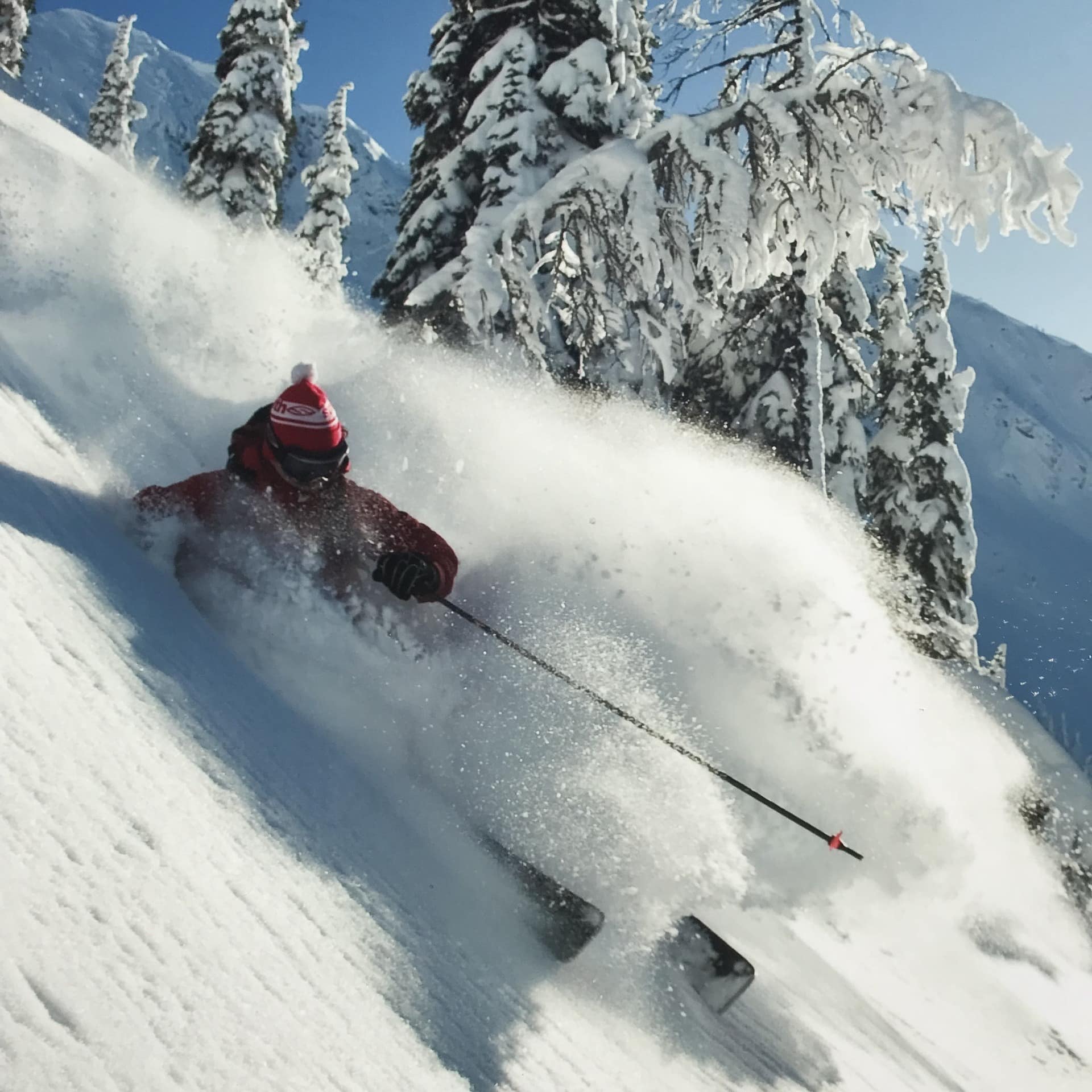 Skier nearly covered in snow in Nelson