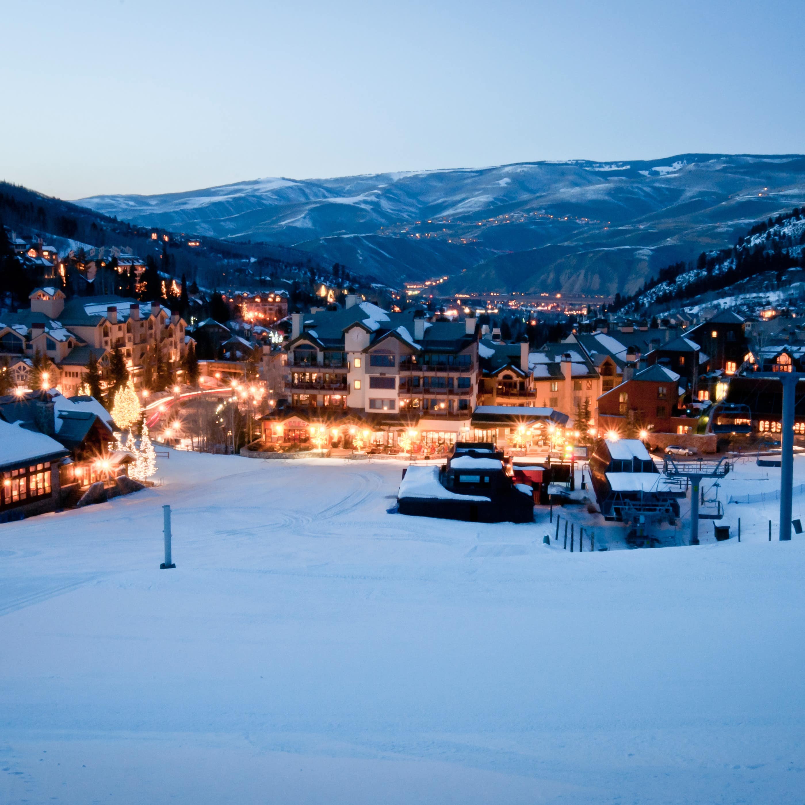 Mountain view and a snow-covered village at dusk