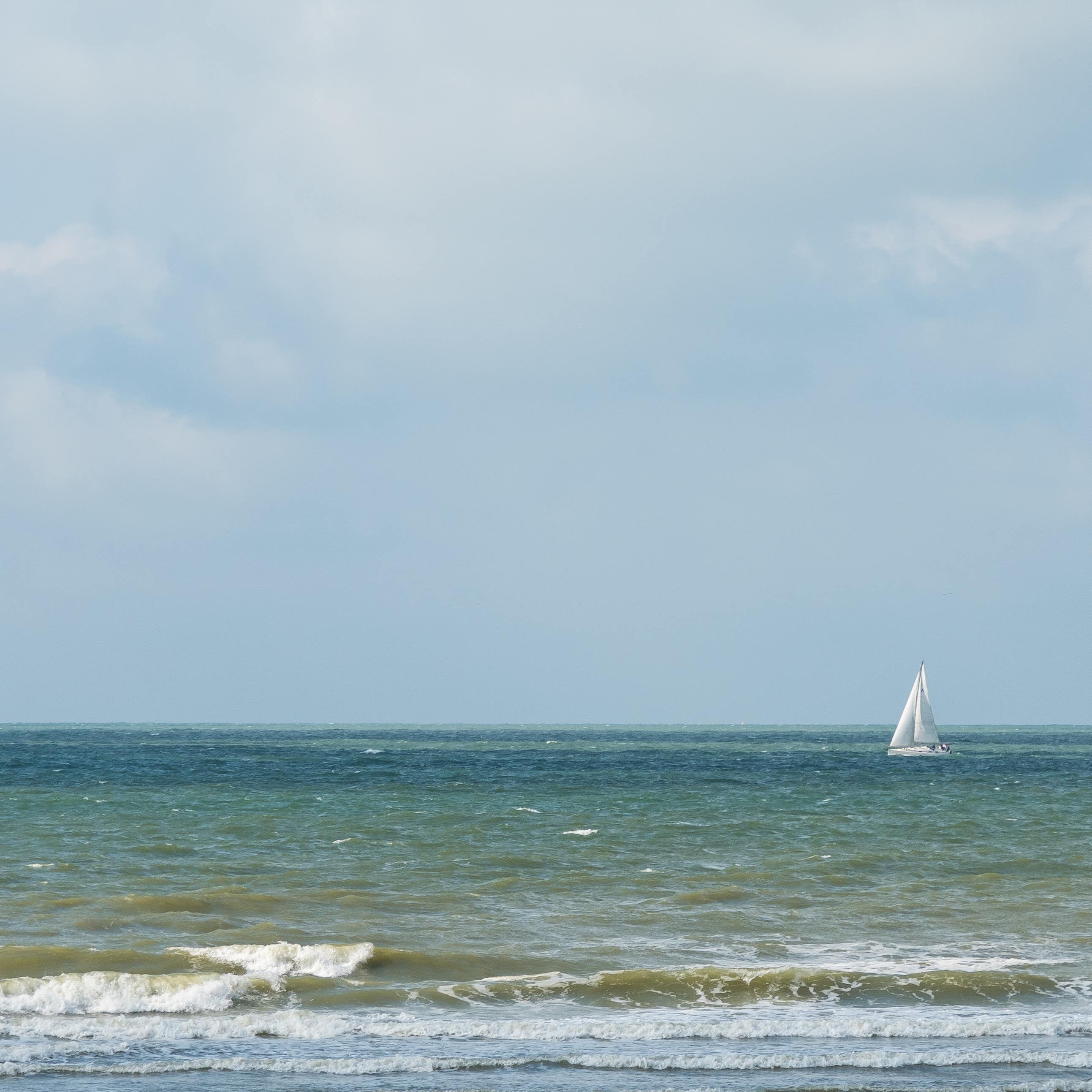 Sail boat on the North Sea in Ostend, Belgium 