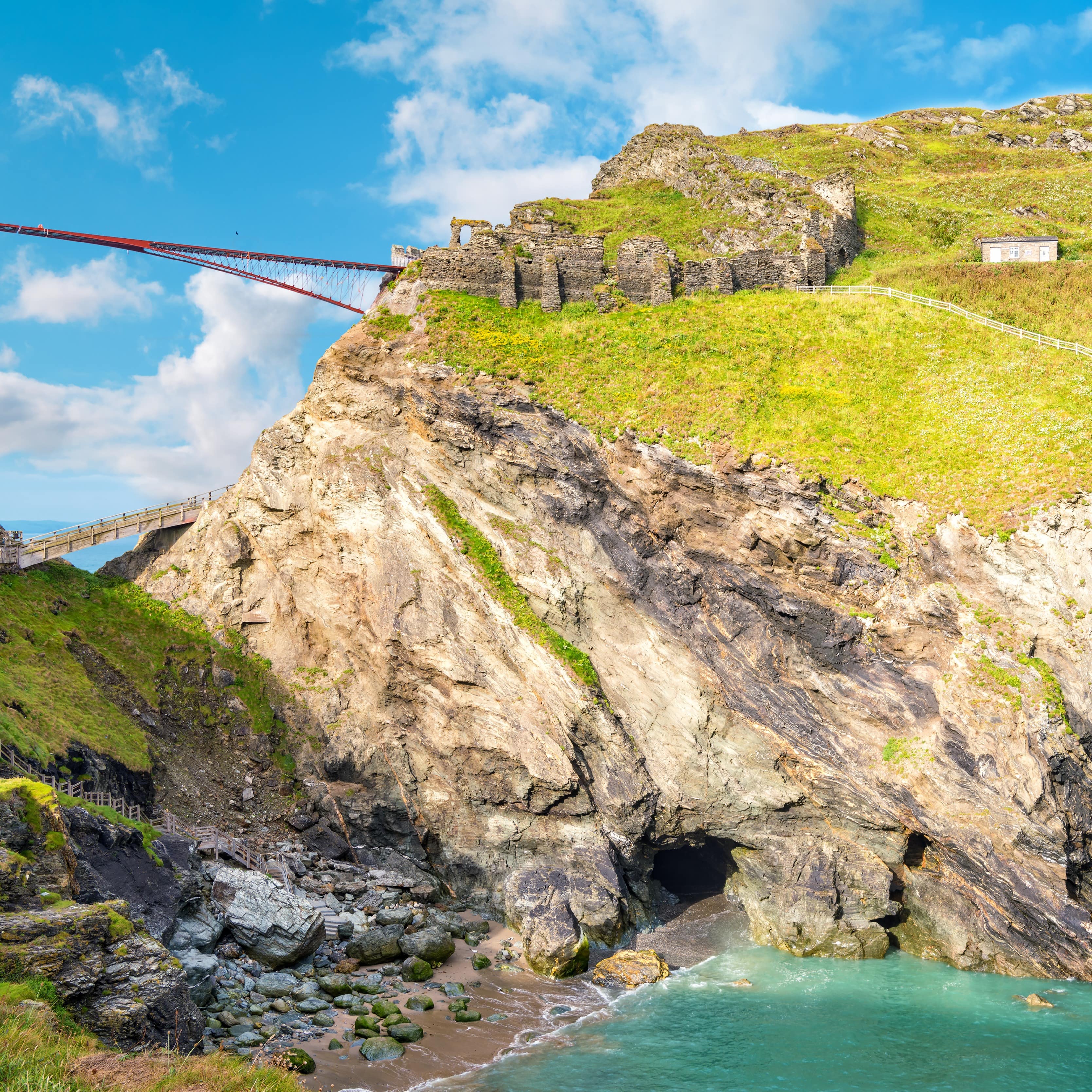 View to Tintagel island, the legendary Tintagel castle ruins and Merlin's cave