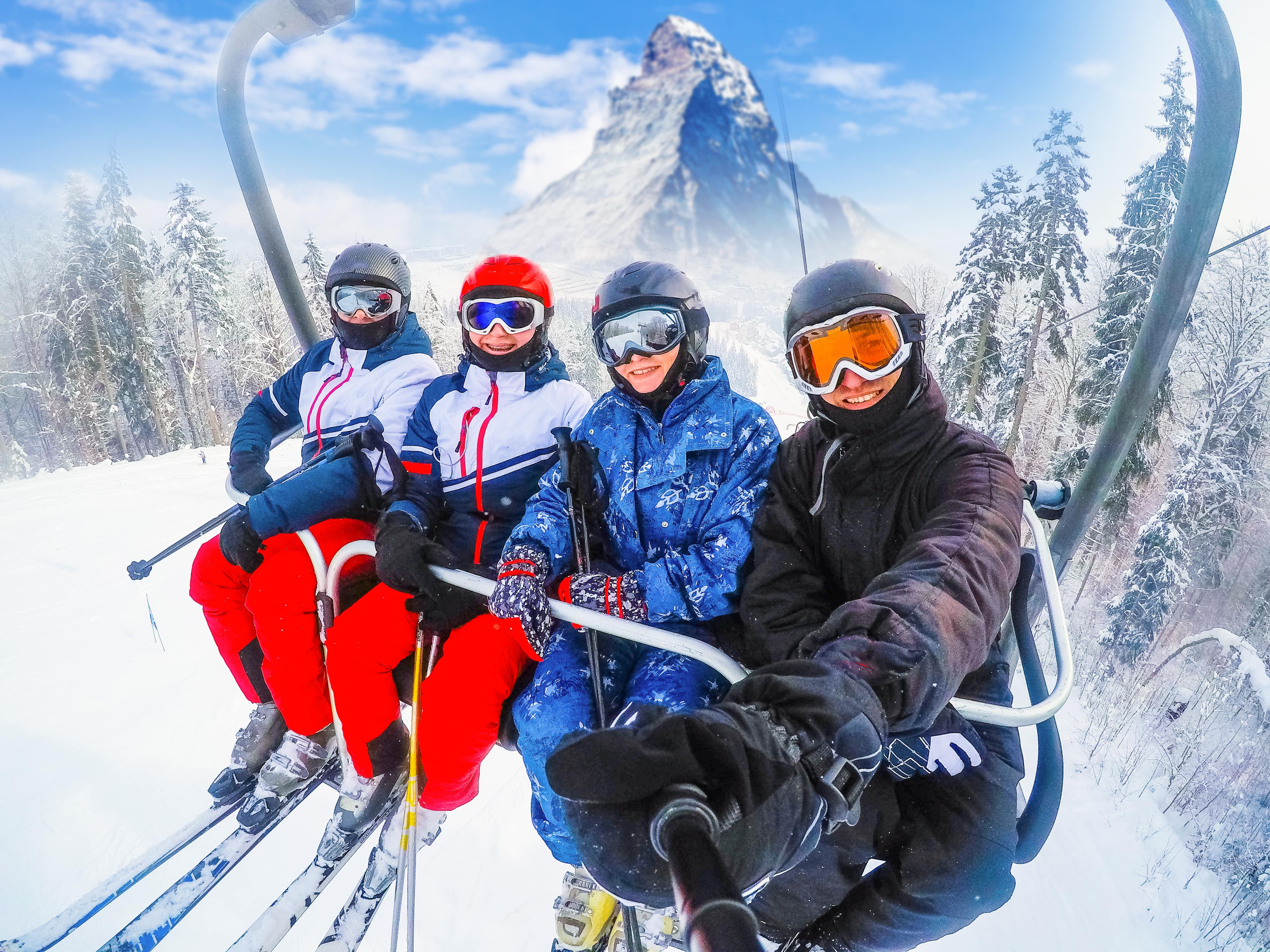 Beautiful view in Switzerland with cable chairlift transport cheerful young friends skiers on ski lift