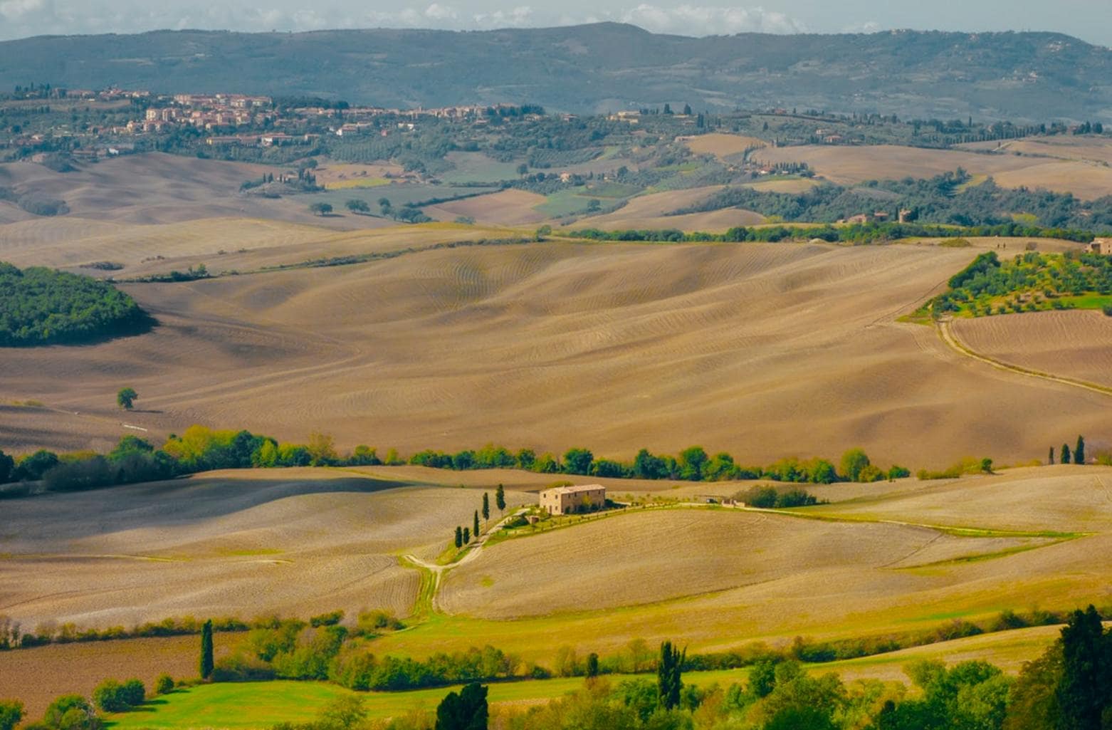 An Italian cottage stands near the town of Montepulciano in Tuscany