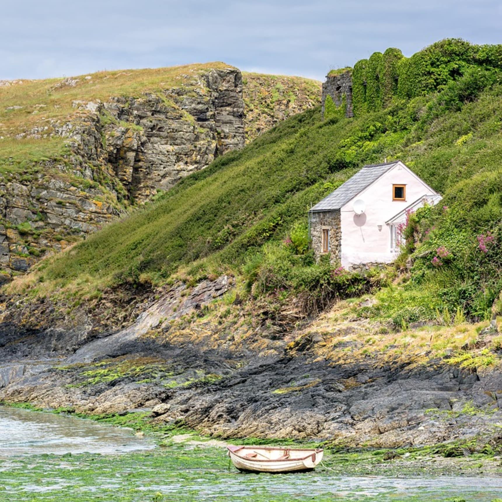 A small lodging stands on the coast of Wales
