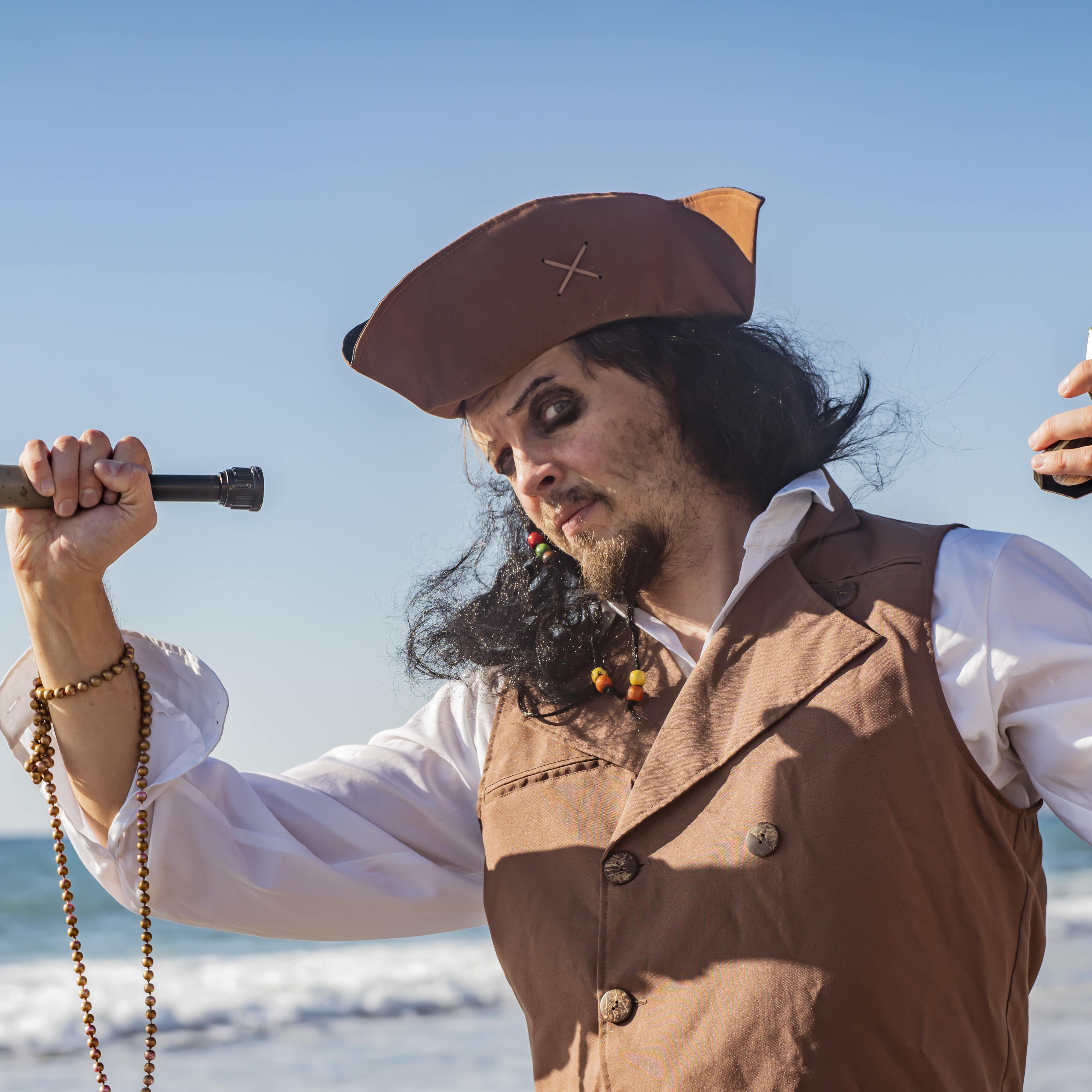 Man in a pirate costume at sea