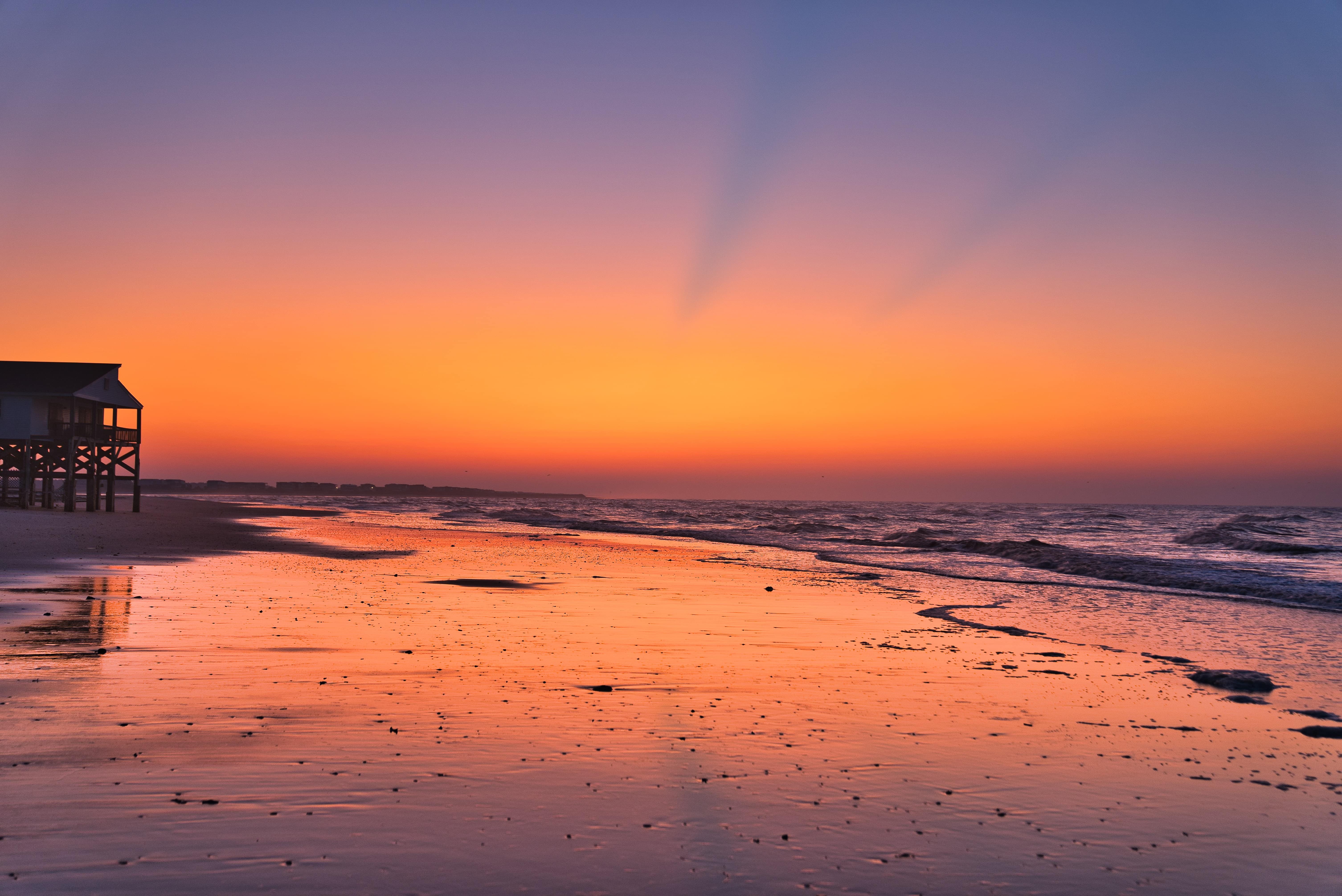 Stock image - Ocean Isle Beach beach house at sunrise sunset - Photo by Clint Patterson on Unsplash