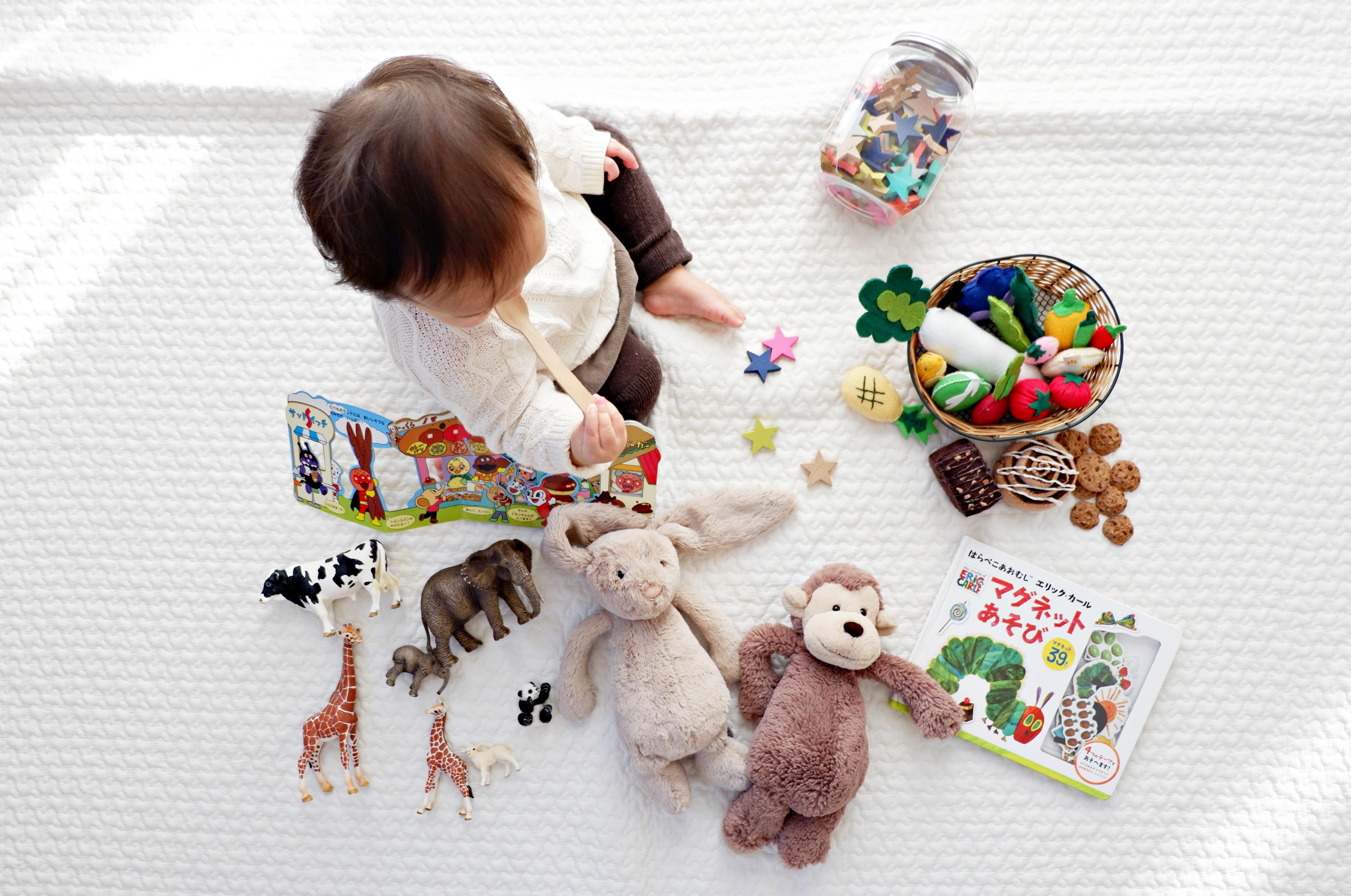 Stock image - Baby girl child playing wit toys in the home - Shitota Yuri