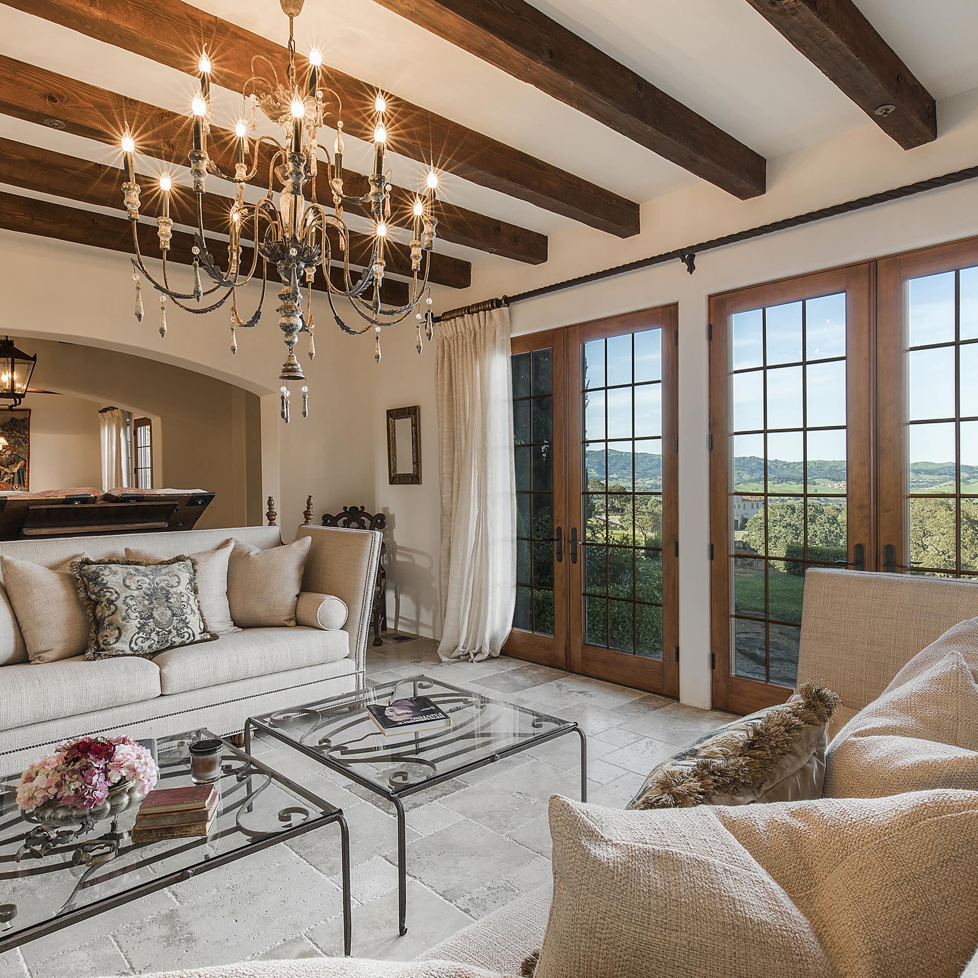 An elegant living room with a view of vineyards in Napa Valley, California