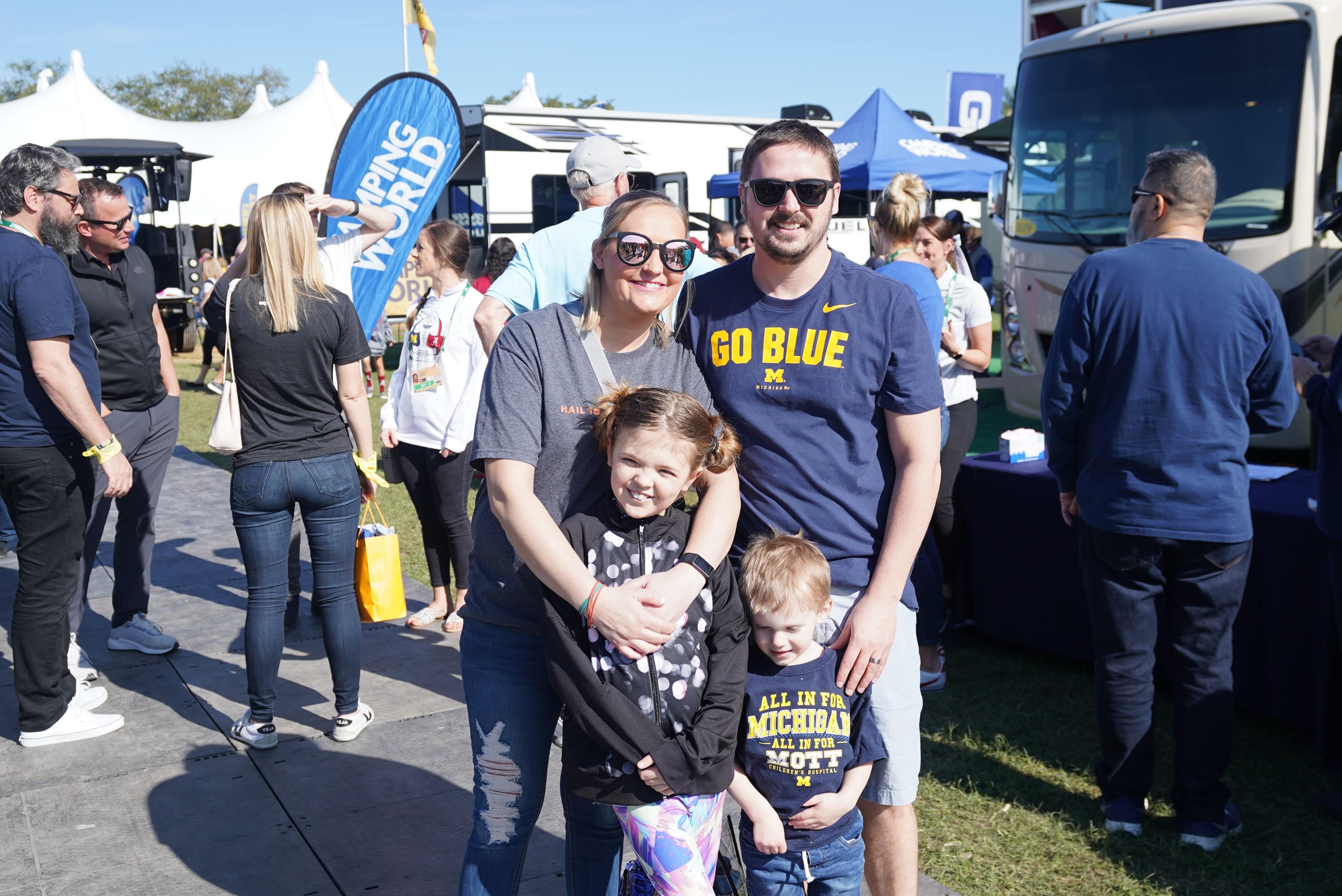 This is a photo of the Buckley family at Camping World Stadium for the 2020 Vrbo Citrus Bowl wearing University of Michigan shirts.