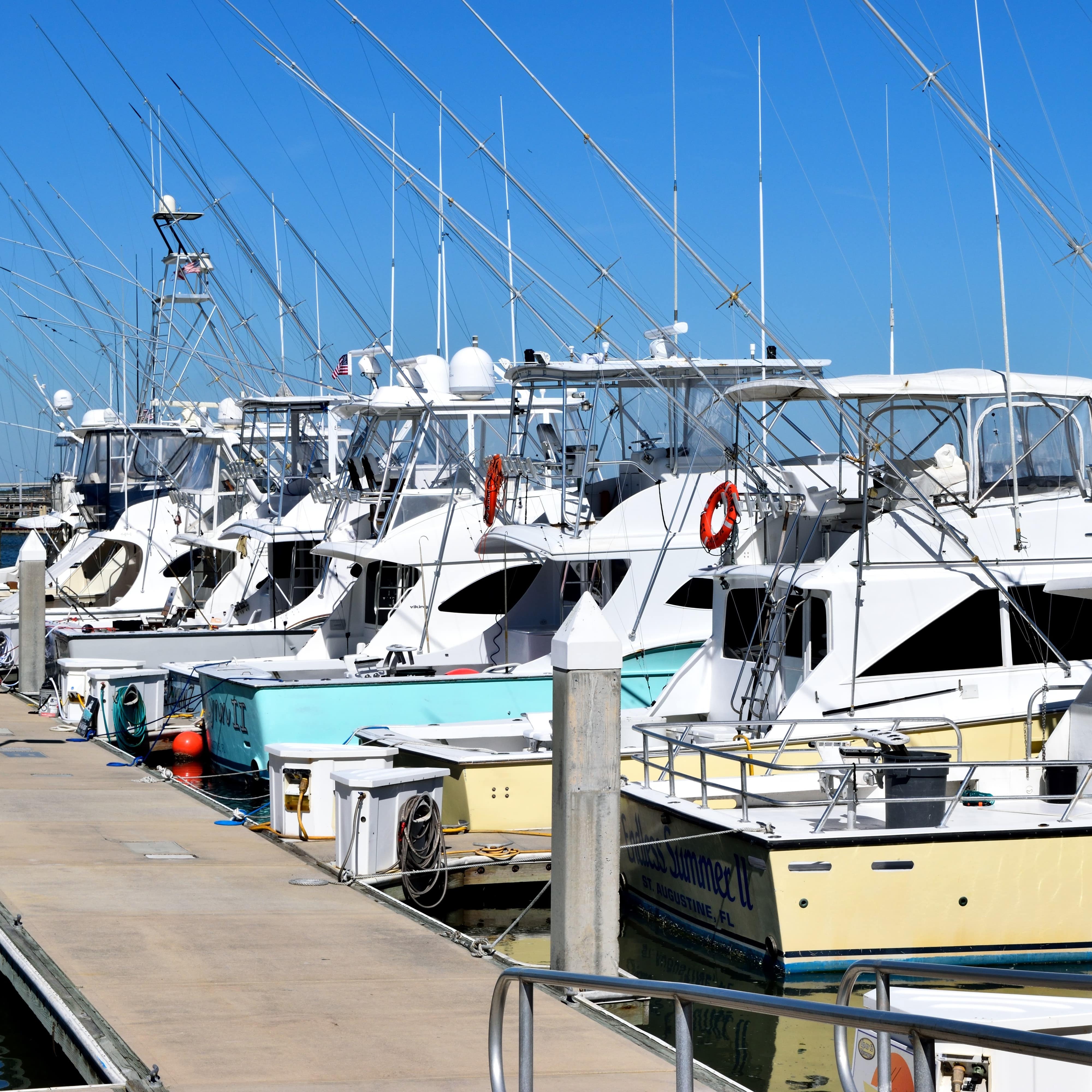 Colorful fishing boats lined up along a jetty