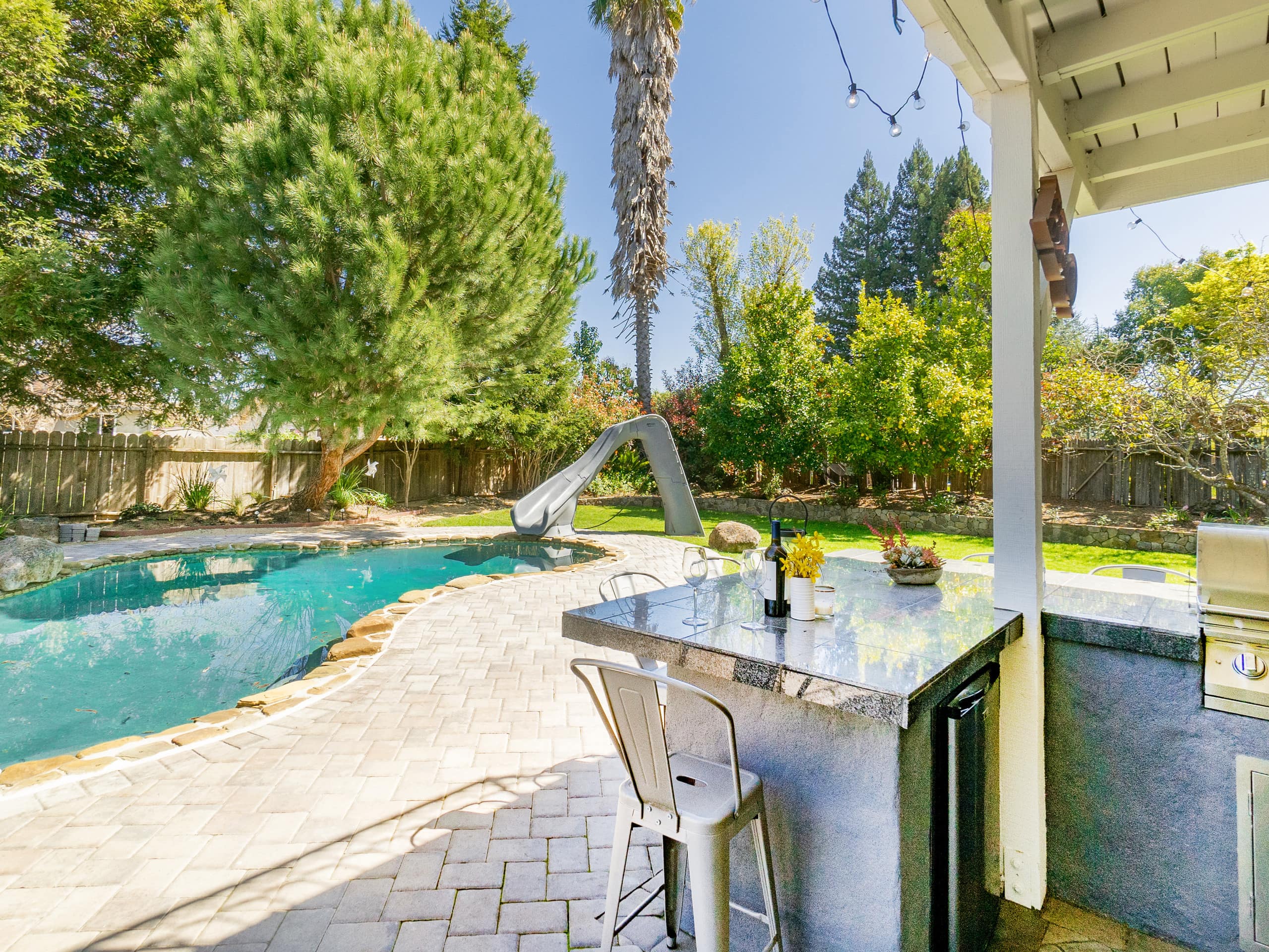 This resort-style getaway in Napa features a heated pool and waterslide