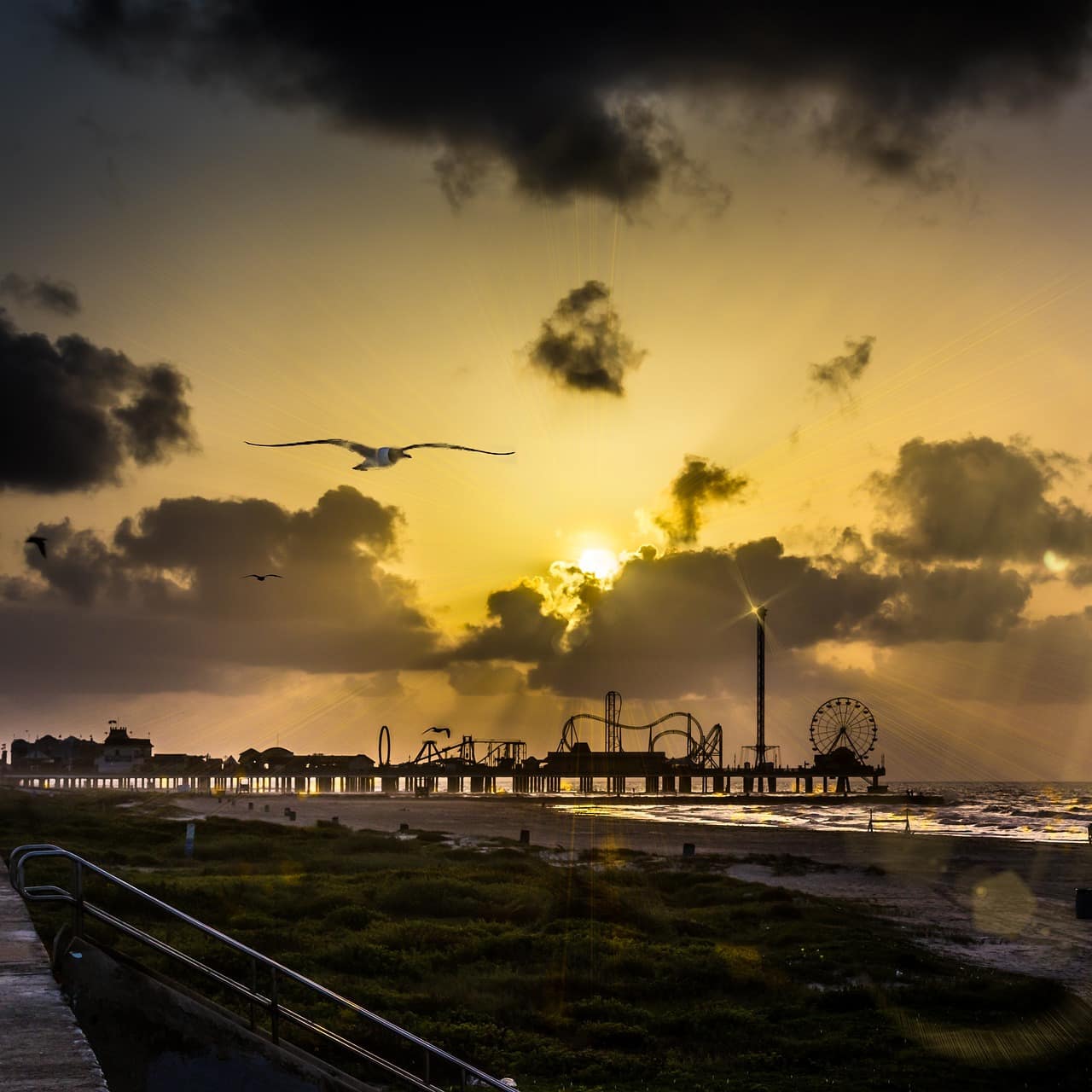 Sunrise over the Pleasure Pier at Galveston Beach