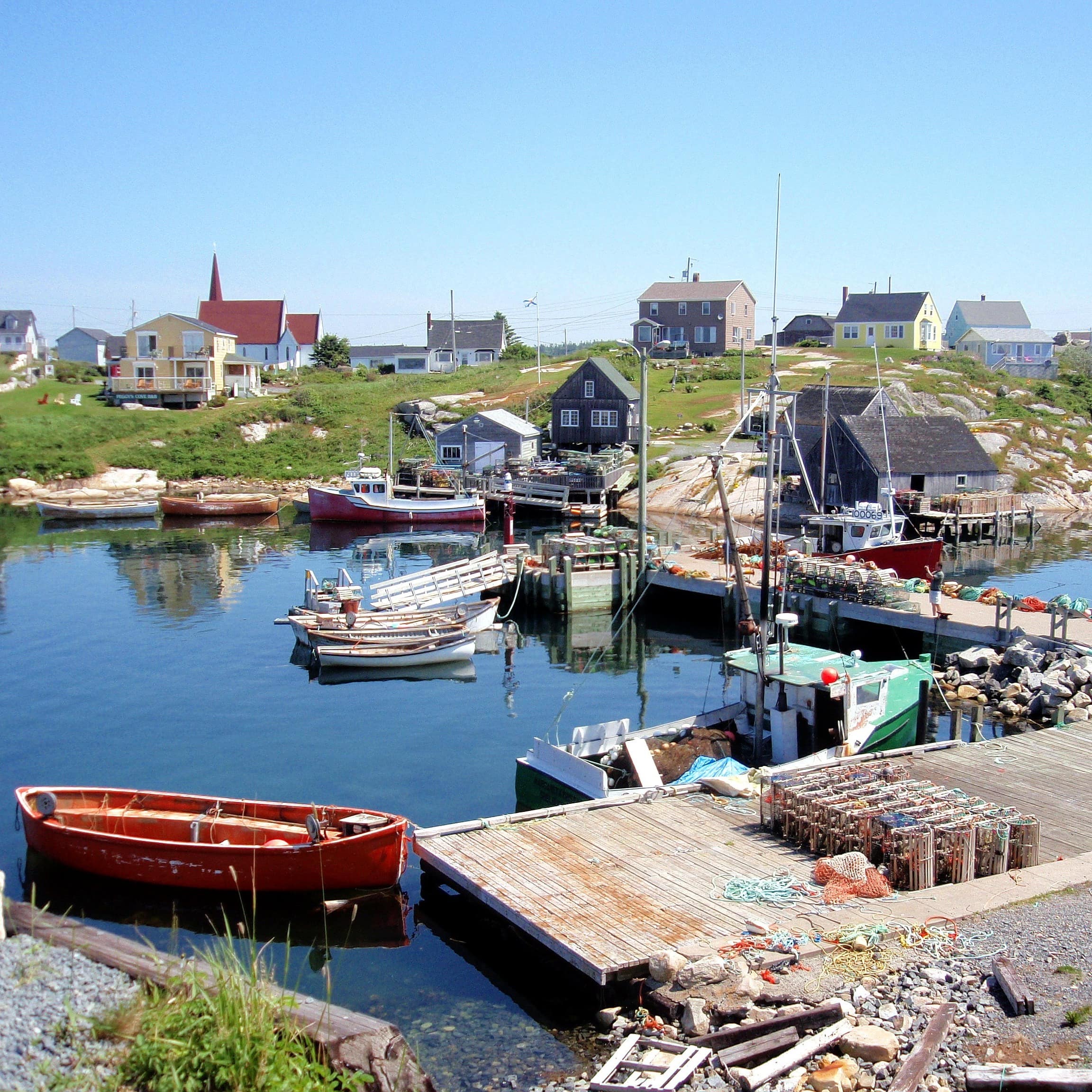 Fishing boats and cottages in a sheltered cove in Nova Scotia