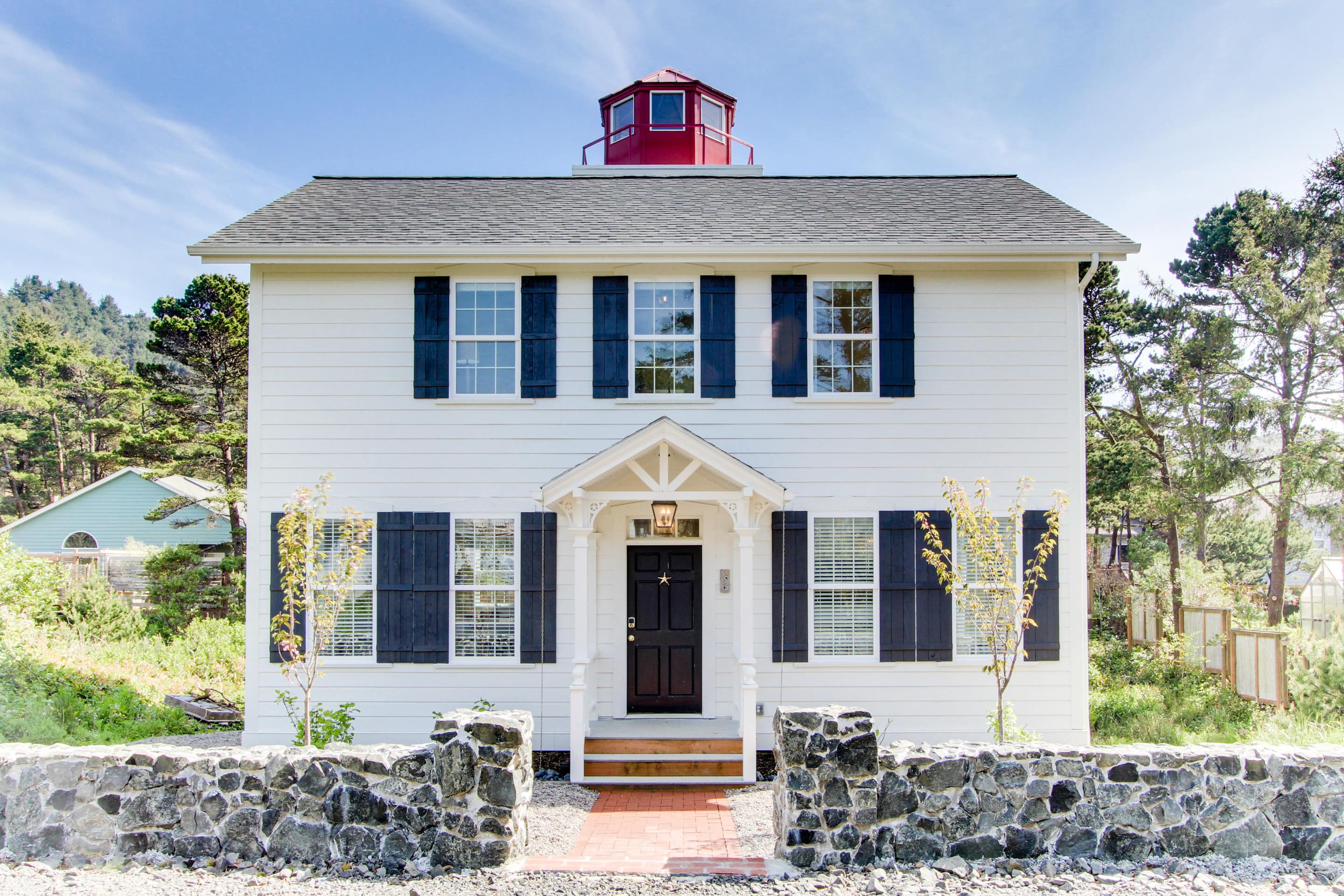 This stunning lighthouse replica home is just steps from the beach in Newport