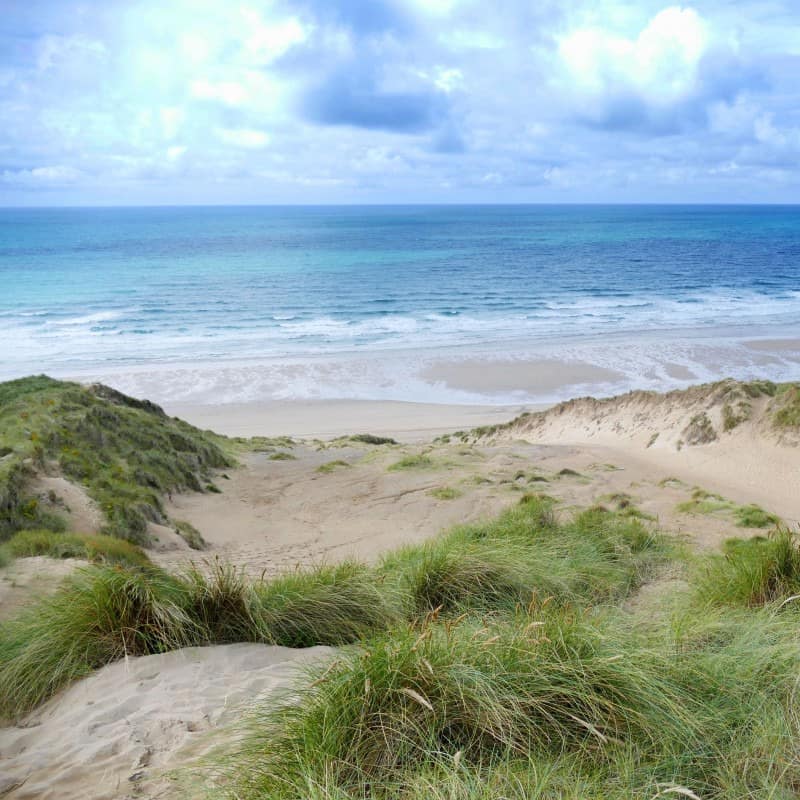 A sandy landscape along the Cornish coast.