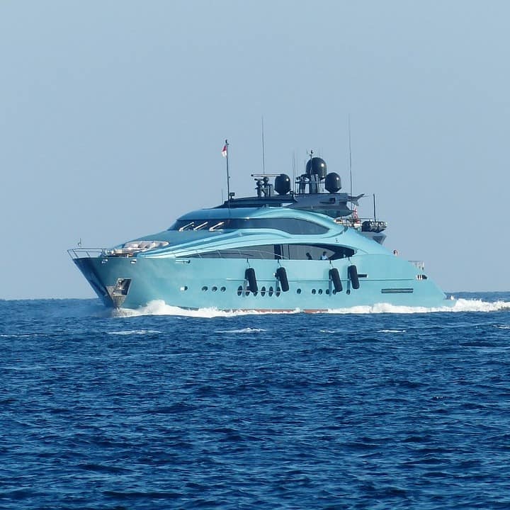 A blue motor yacht available to charter