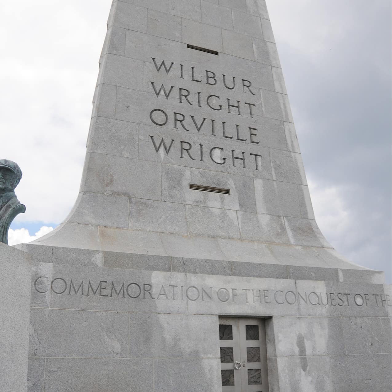 A granite monument engraved with the names