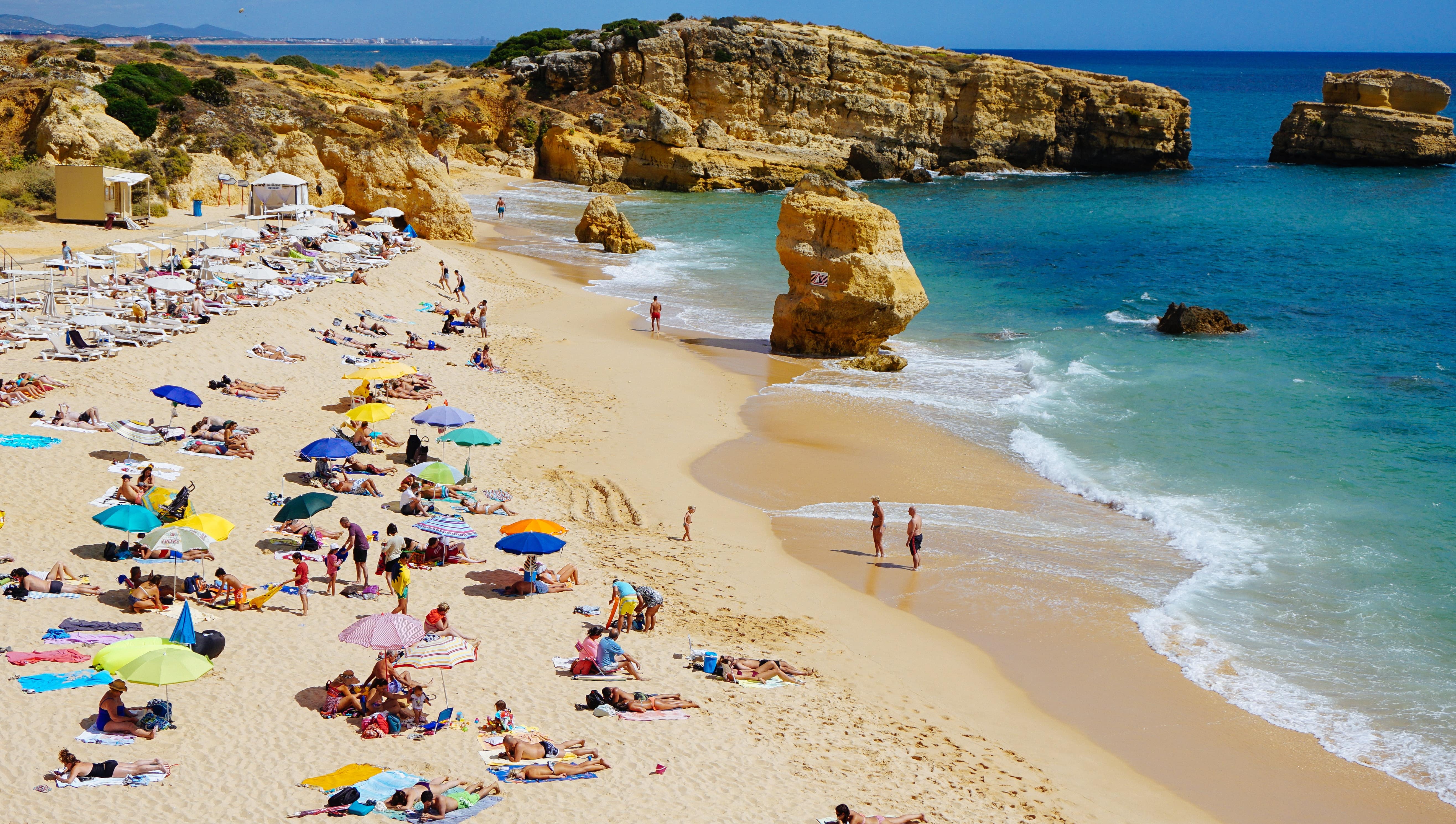 This is an image of vacationers on a sunny beach in Portugal.