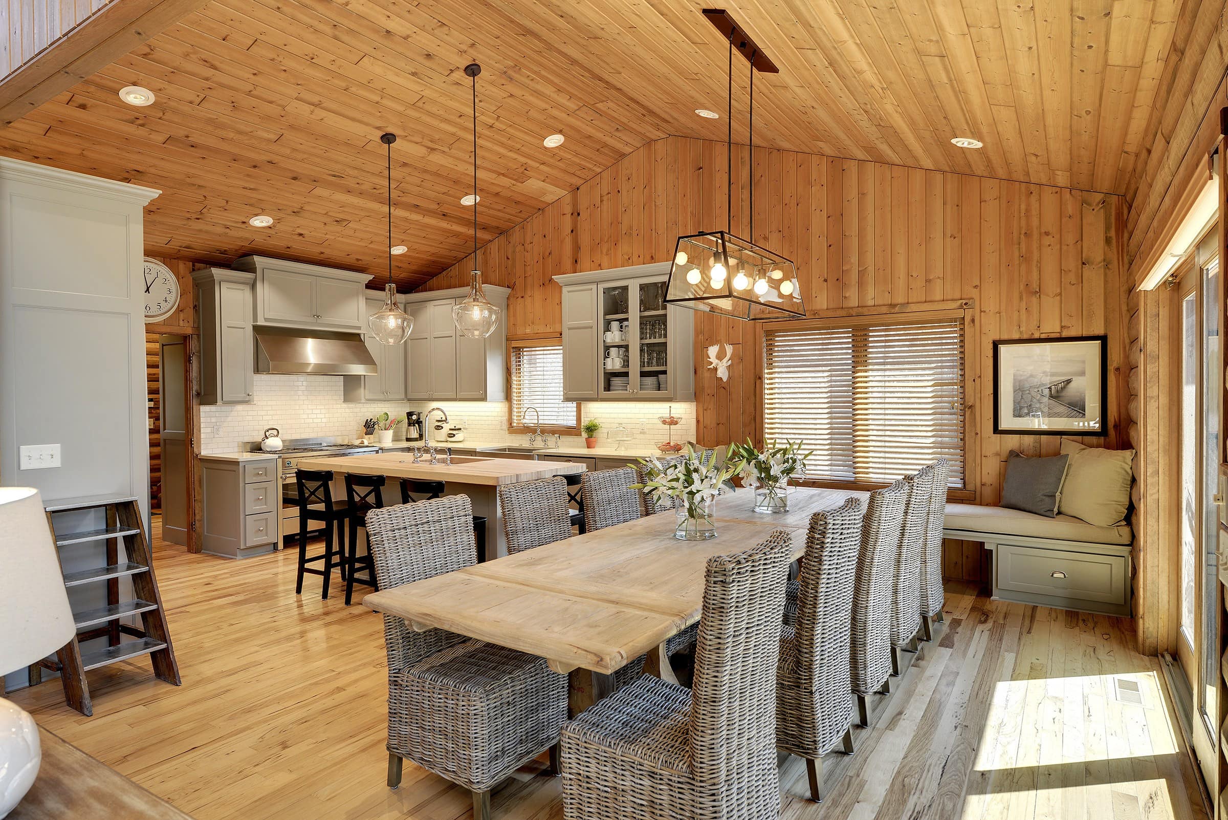 This is a kitchen with a dining table big enough to seat 10 people.
