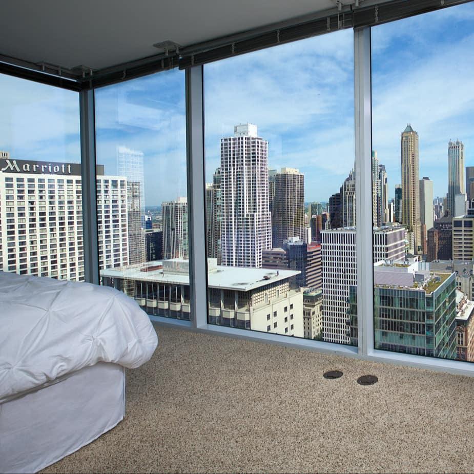 Apartment with glass windows and views of the Chicago skyline