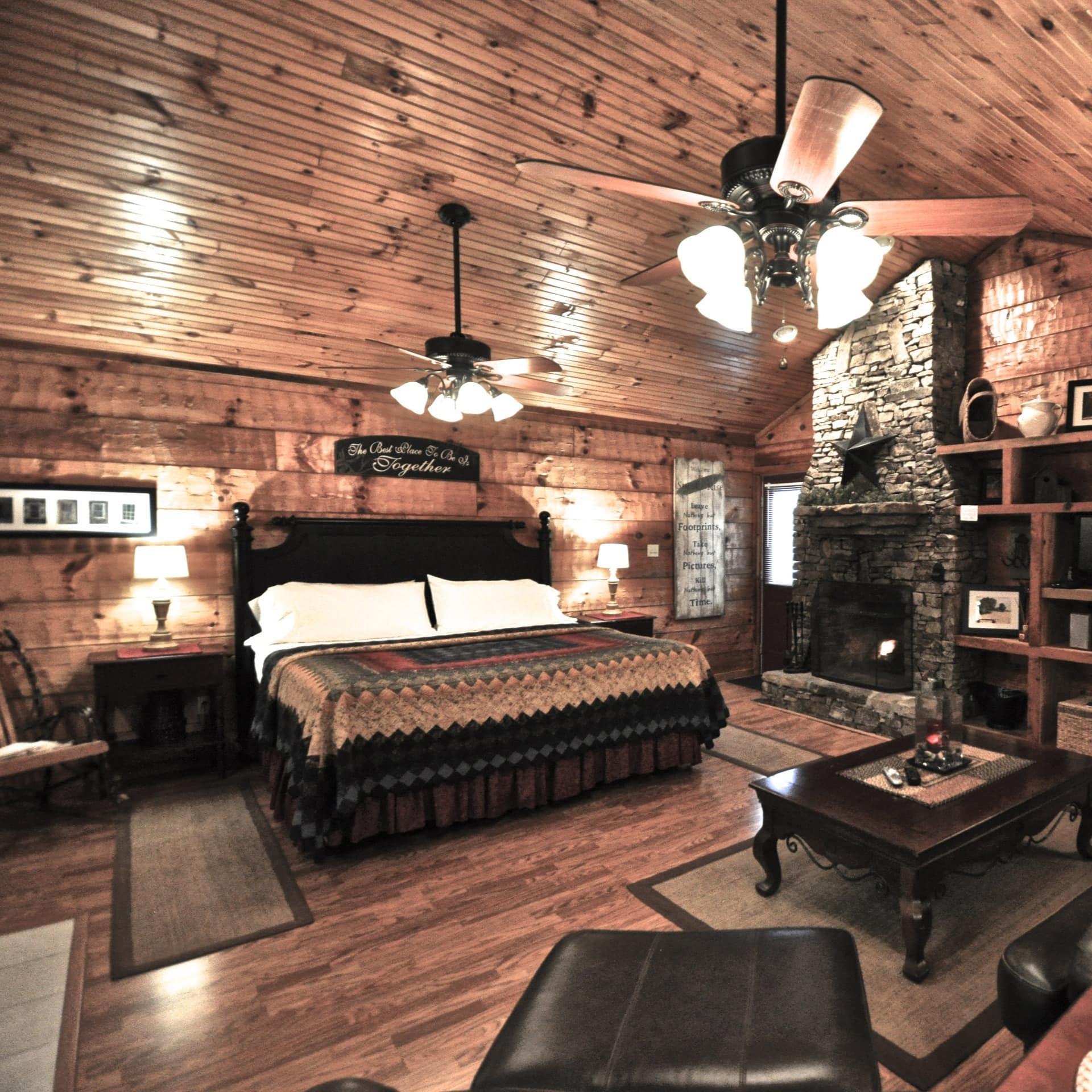 Spacious bedroom with a fireplace and stylish decor in a dog-friendly cabin rental