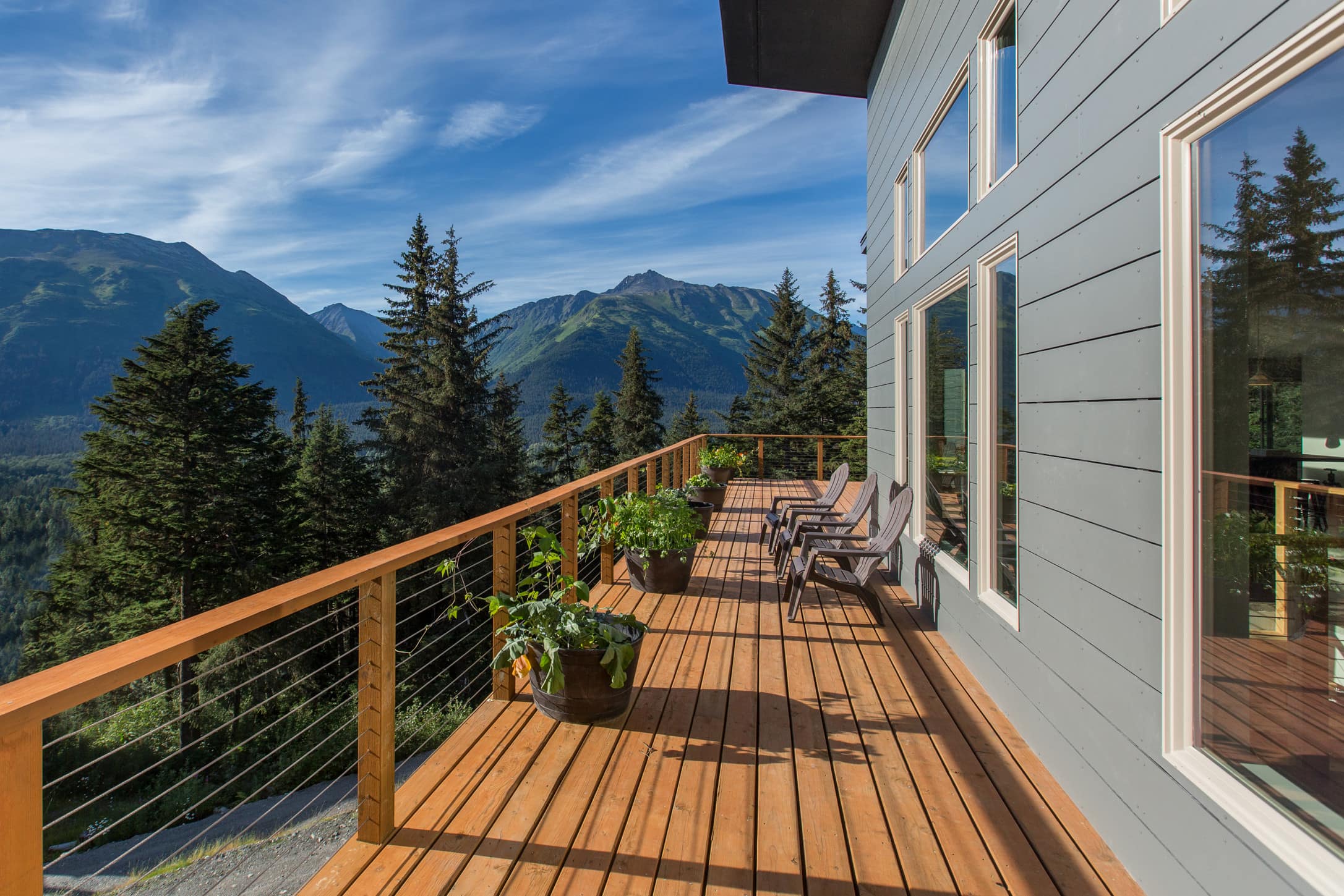 This mountain home in Alaska features stunning views and a hot tub for guests to enjoy