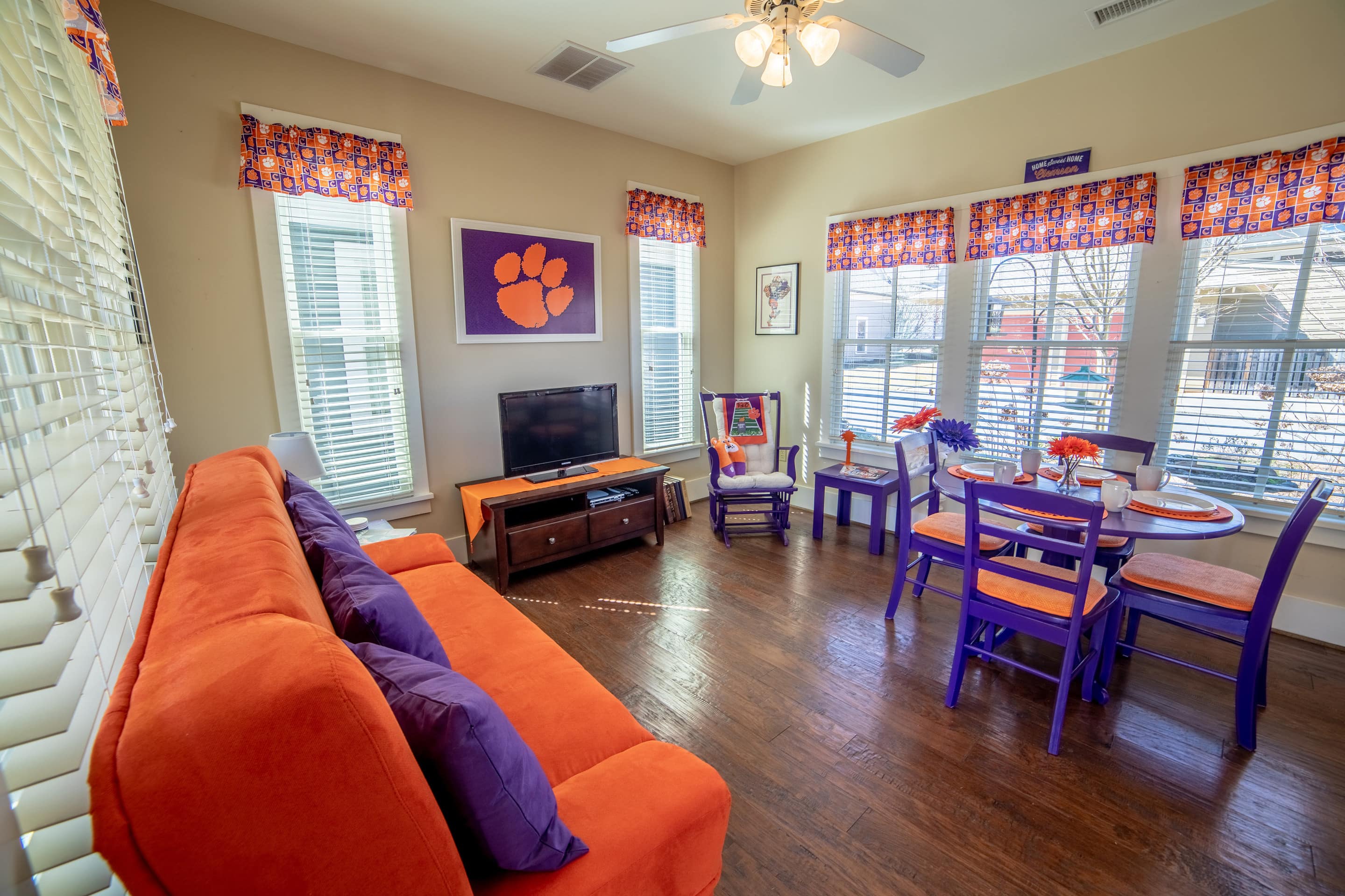 This Clemson Tigers–themed home has orange and purple furniture and decorations.