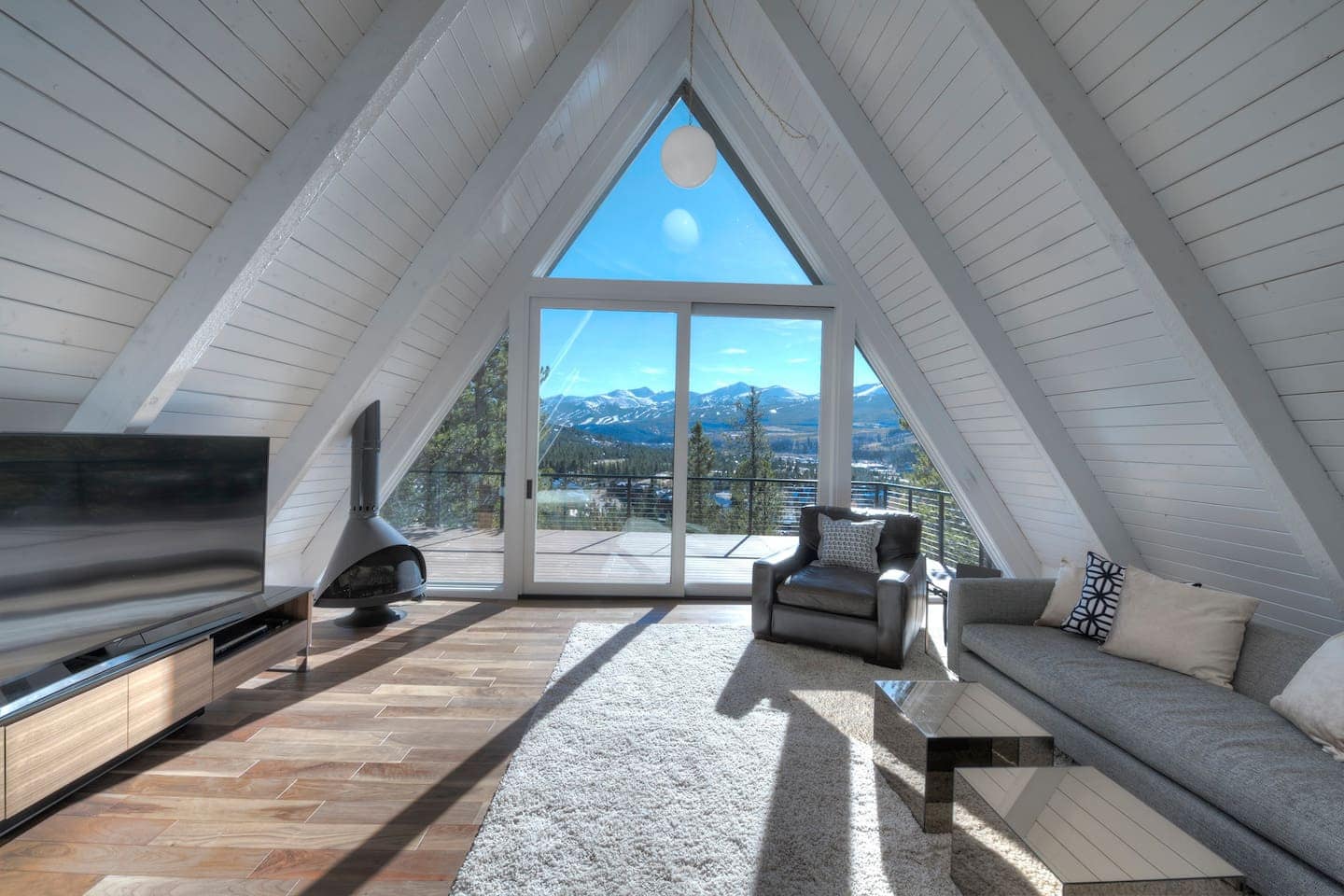 This is a large and airy A-frame home with a view of the mountains.