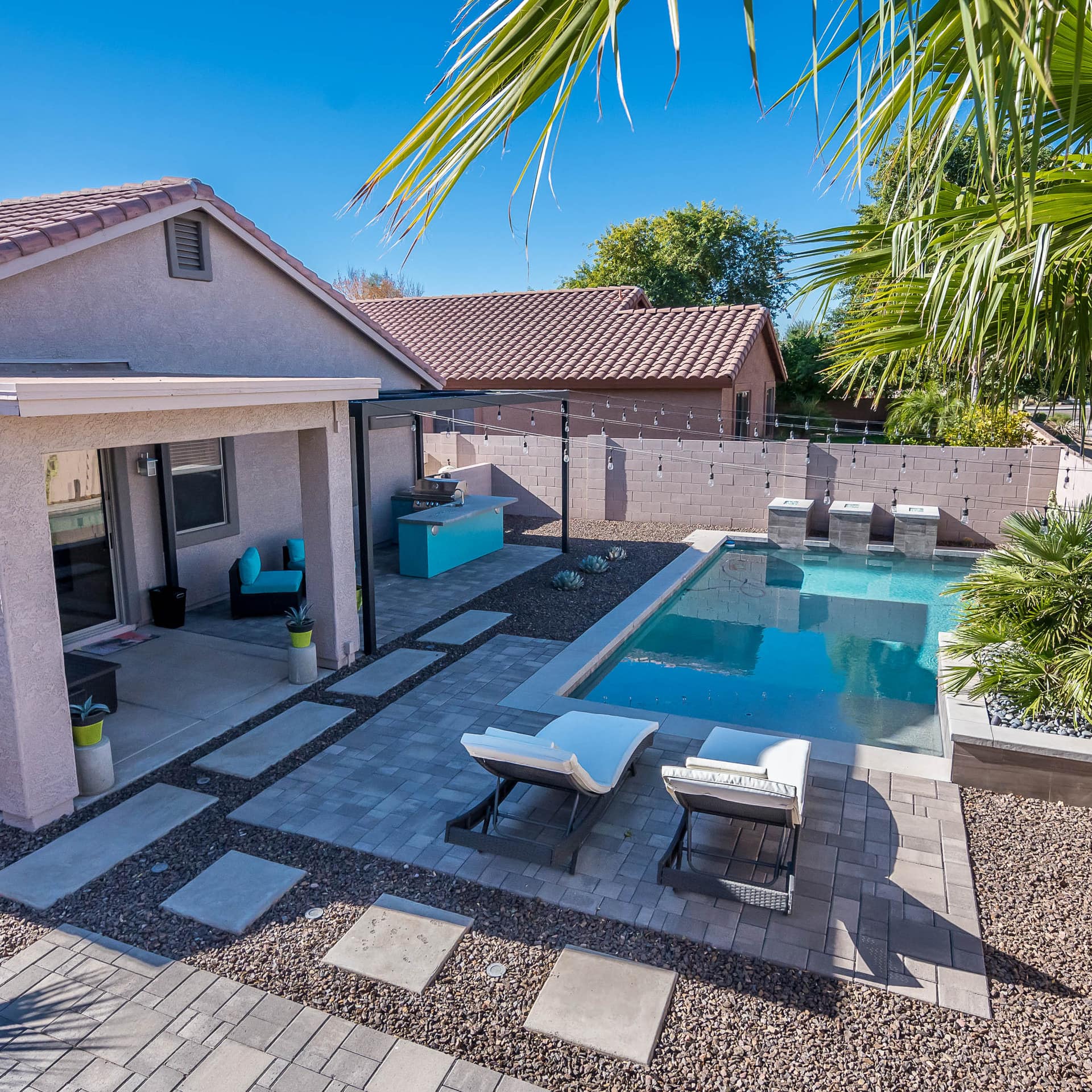 Ranch style home with sun deck, swimming pool and palms in Peoria