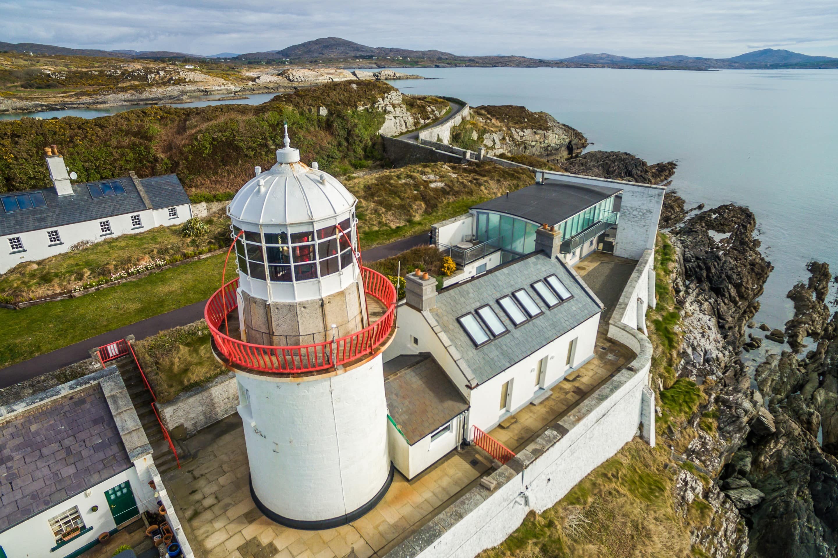 This lighthouse in Cork, Ireland, features panoramic ocean views and sleeping accommodations for 10 guests