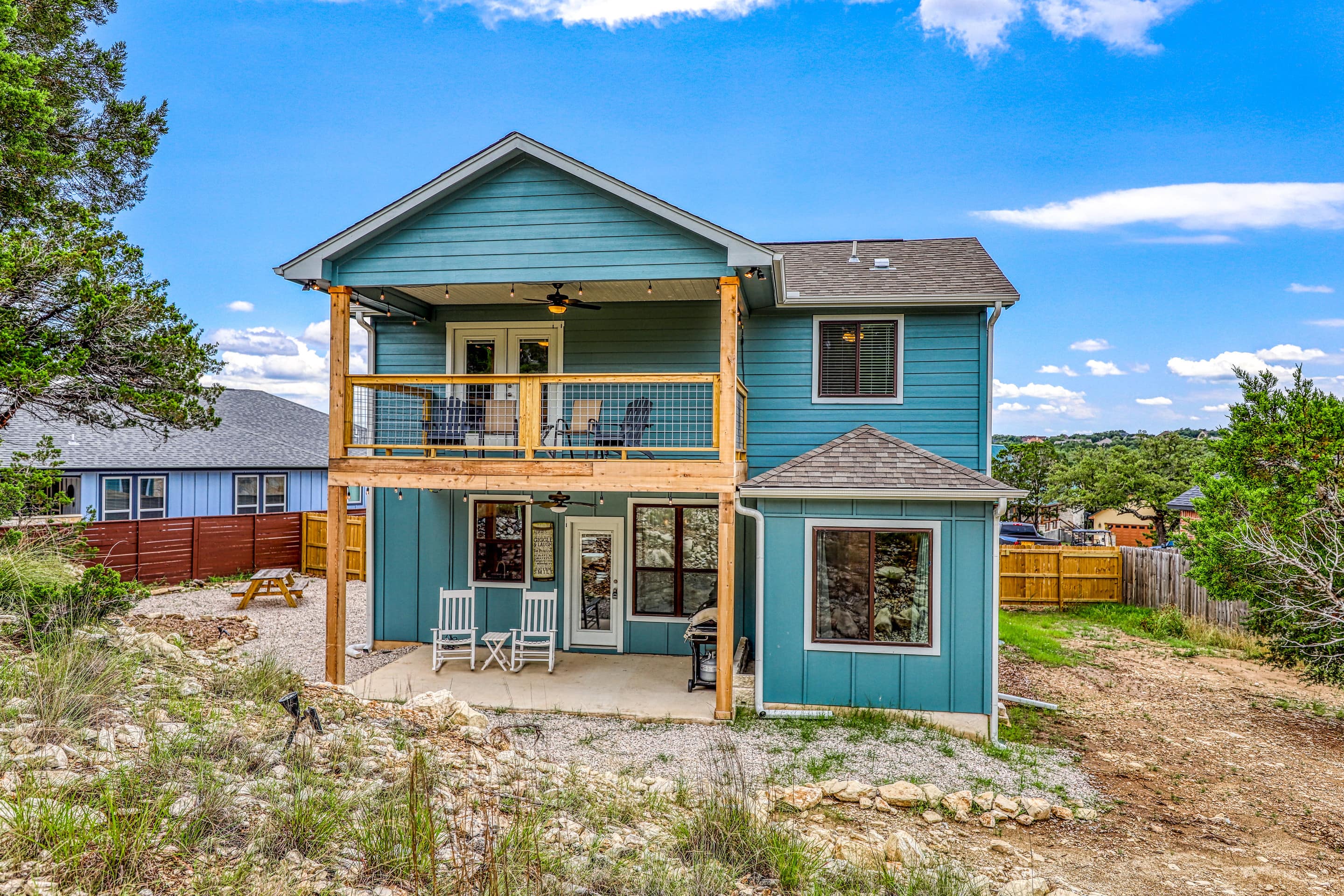 This 3-bedroom home in Wimberley offers a covered deck and stunning views of the Hill Country