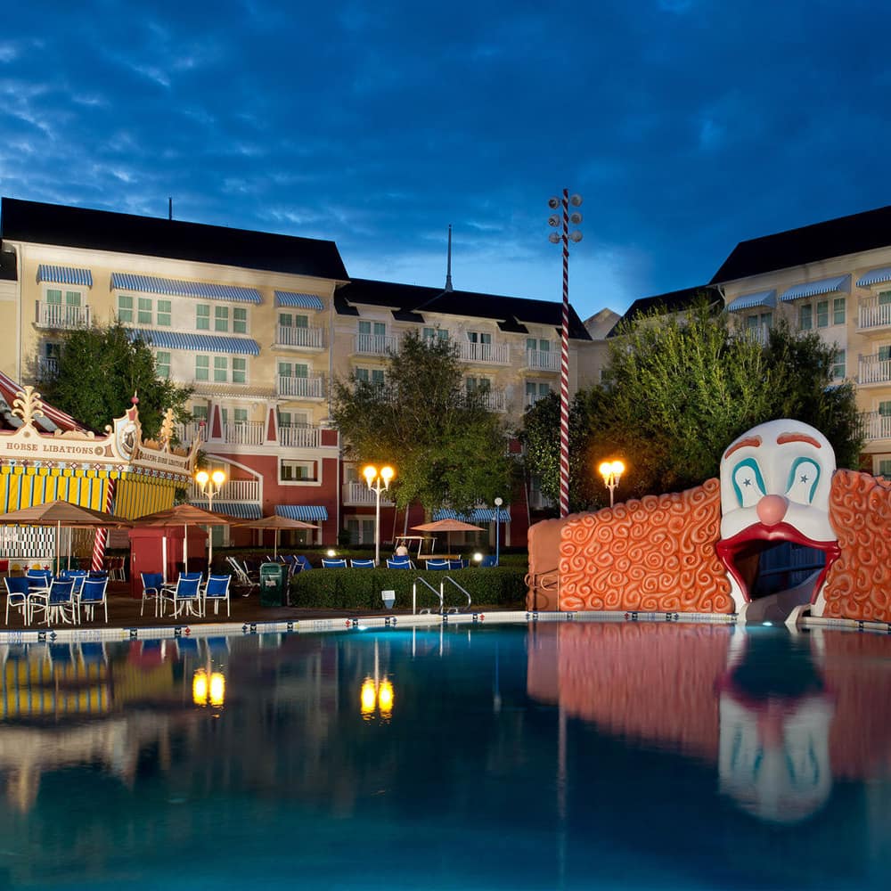 A themed condominium complex has a fun-loving pool hemmed in by rides and attractions