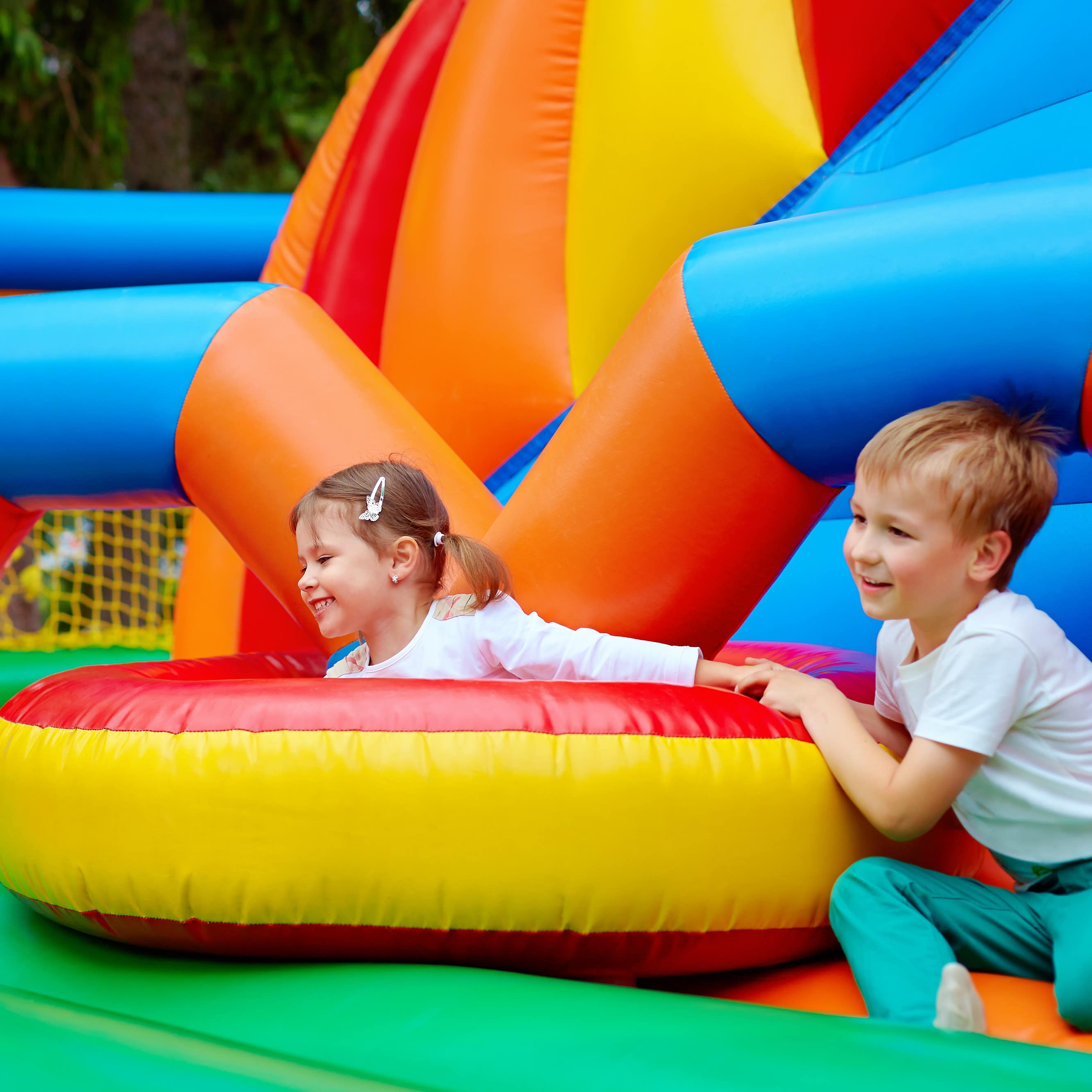 Kids playing at inflatable park