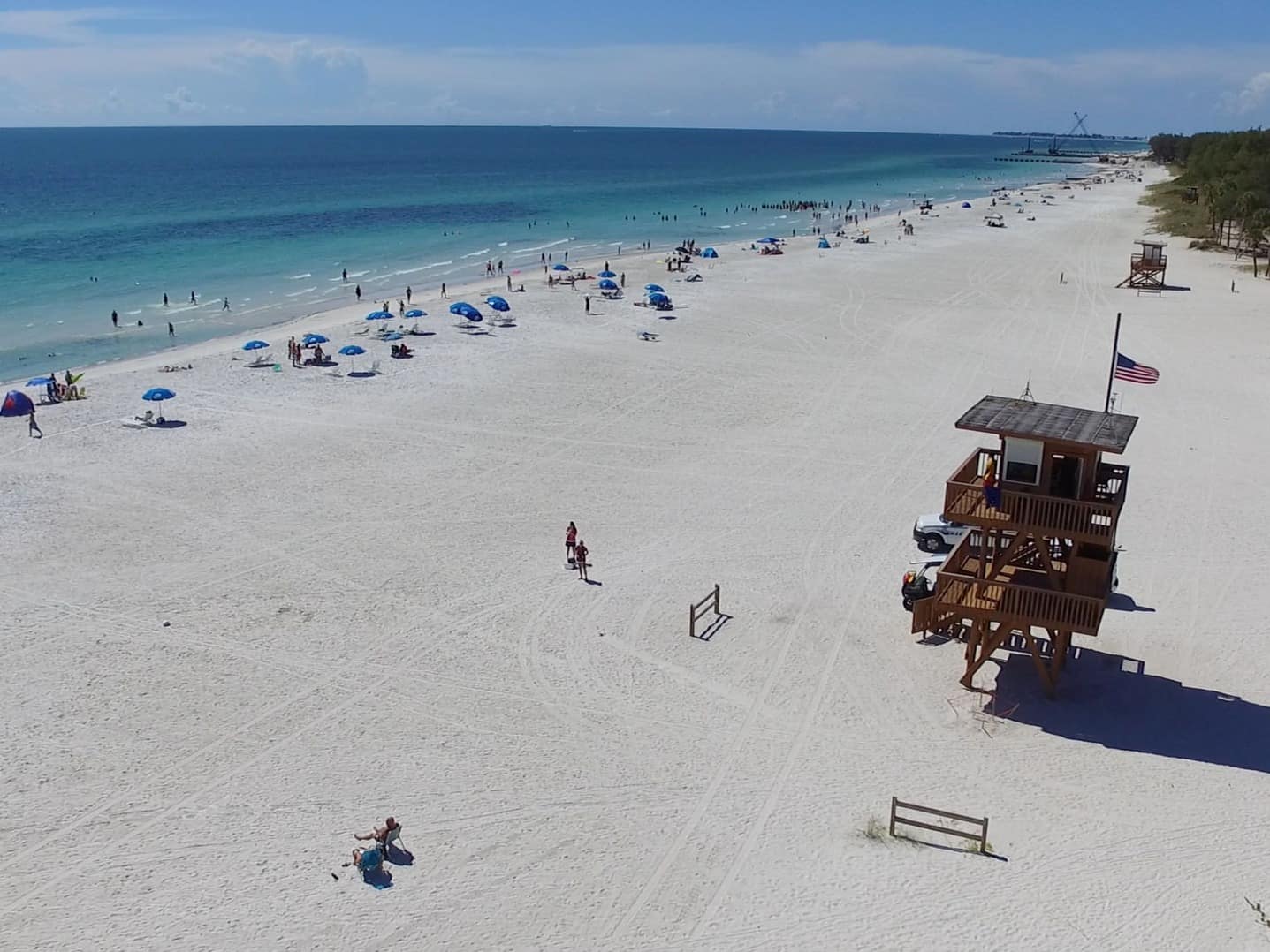 the beach at manatee beach featuring a lifeguard stand