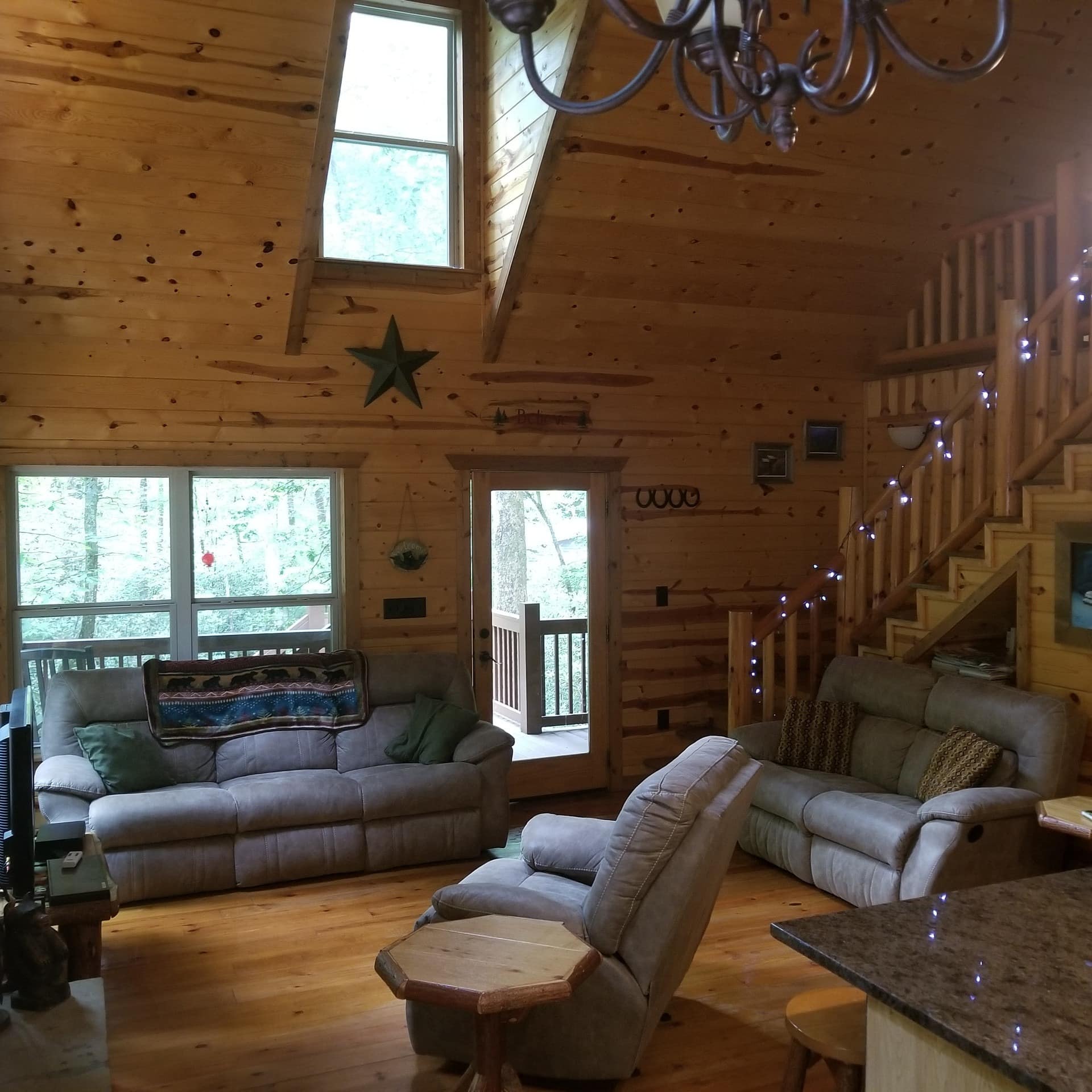 Soaring cabin living room interior with sofas