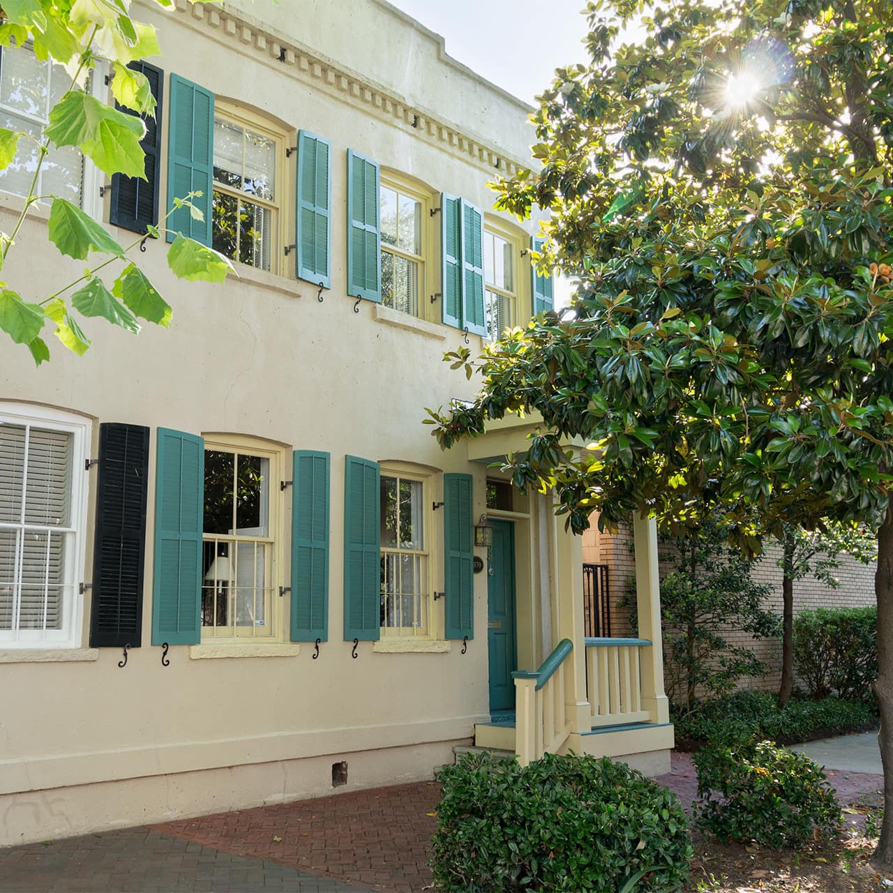 A grand old home sits on the leafy streets of Savannah, GA