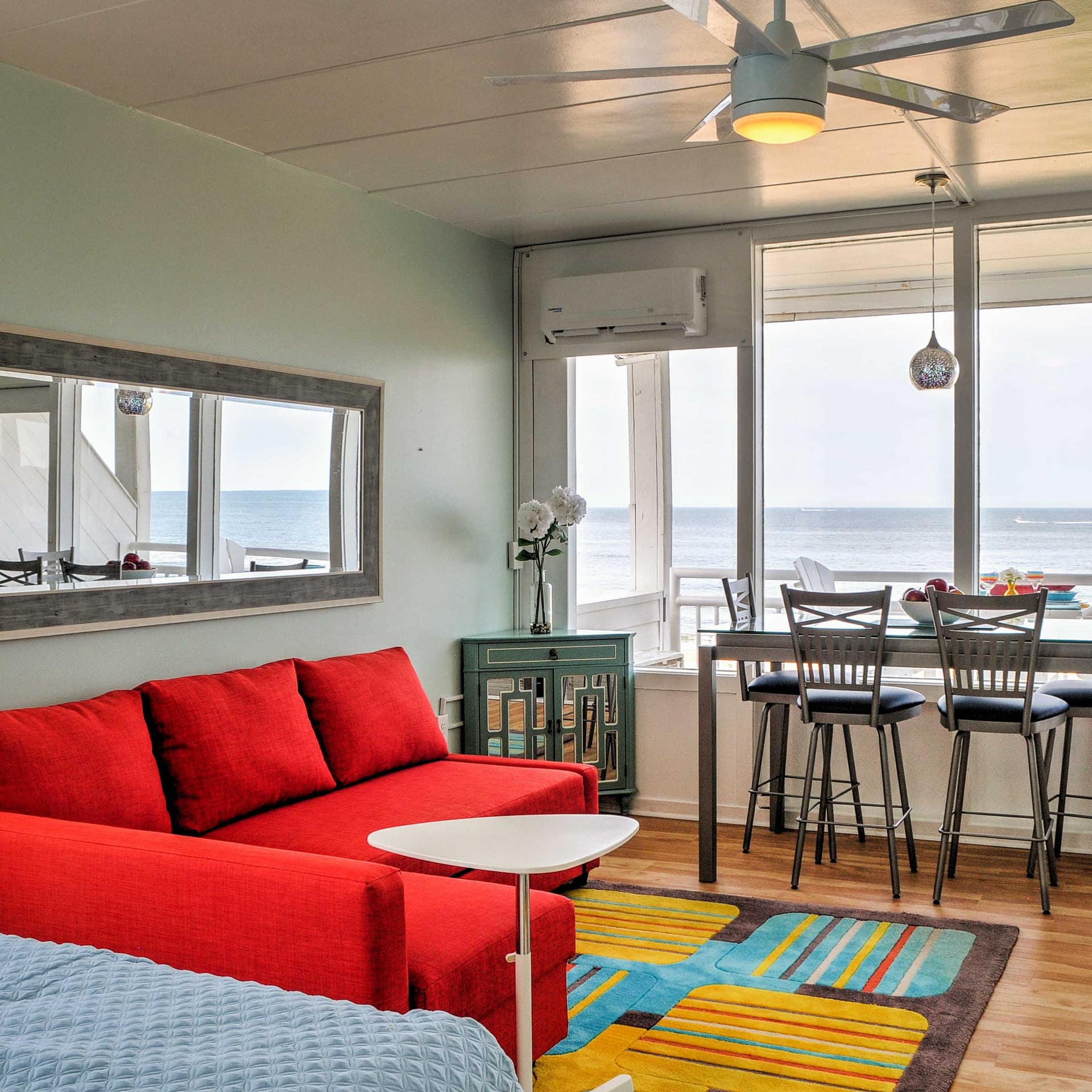 The colorful interior of a condo with beach view