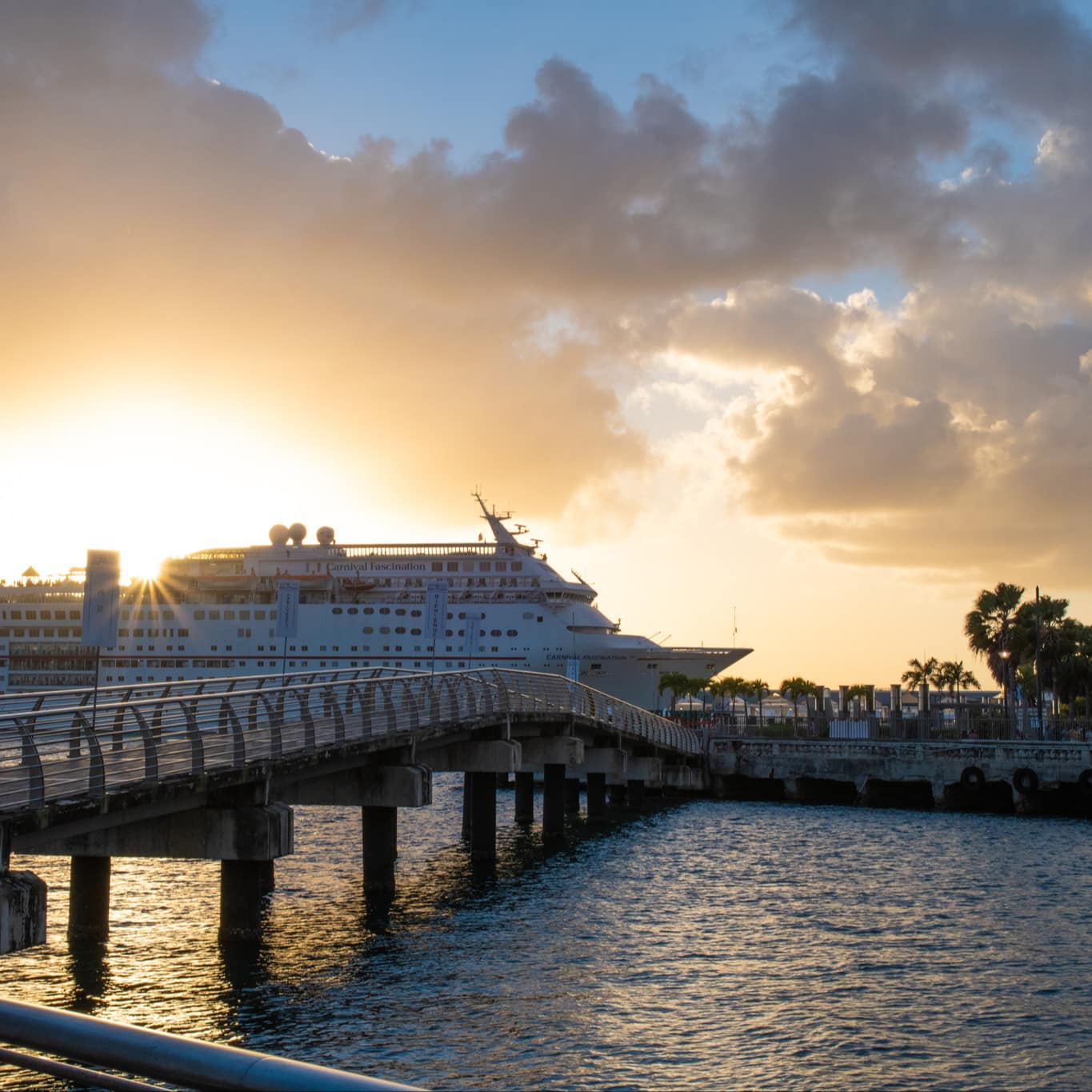 A cruise ship docked at Bahia Urbana, San Juan, at sunset