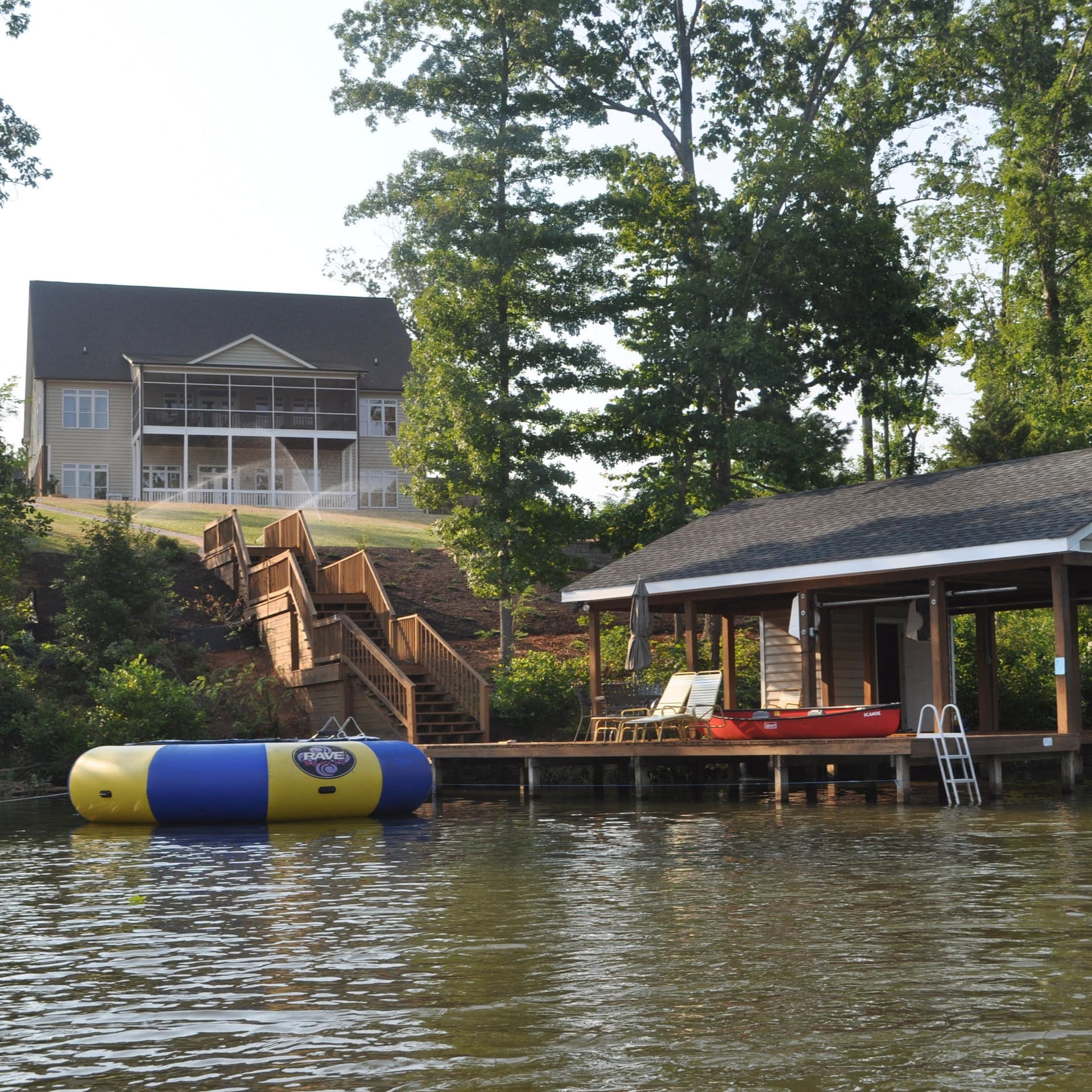 A lakefront vacation rental on Lake Gaston with a boathouse and covered boat slips