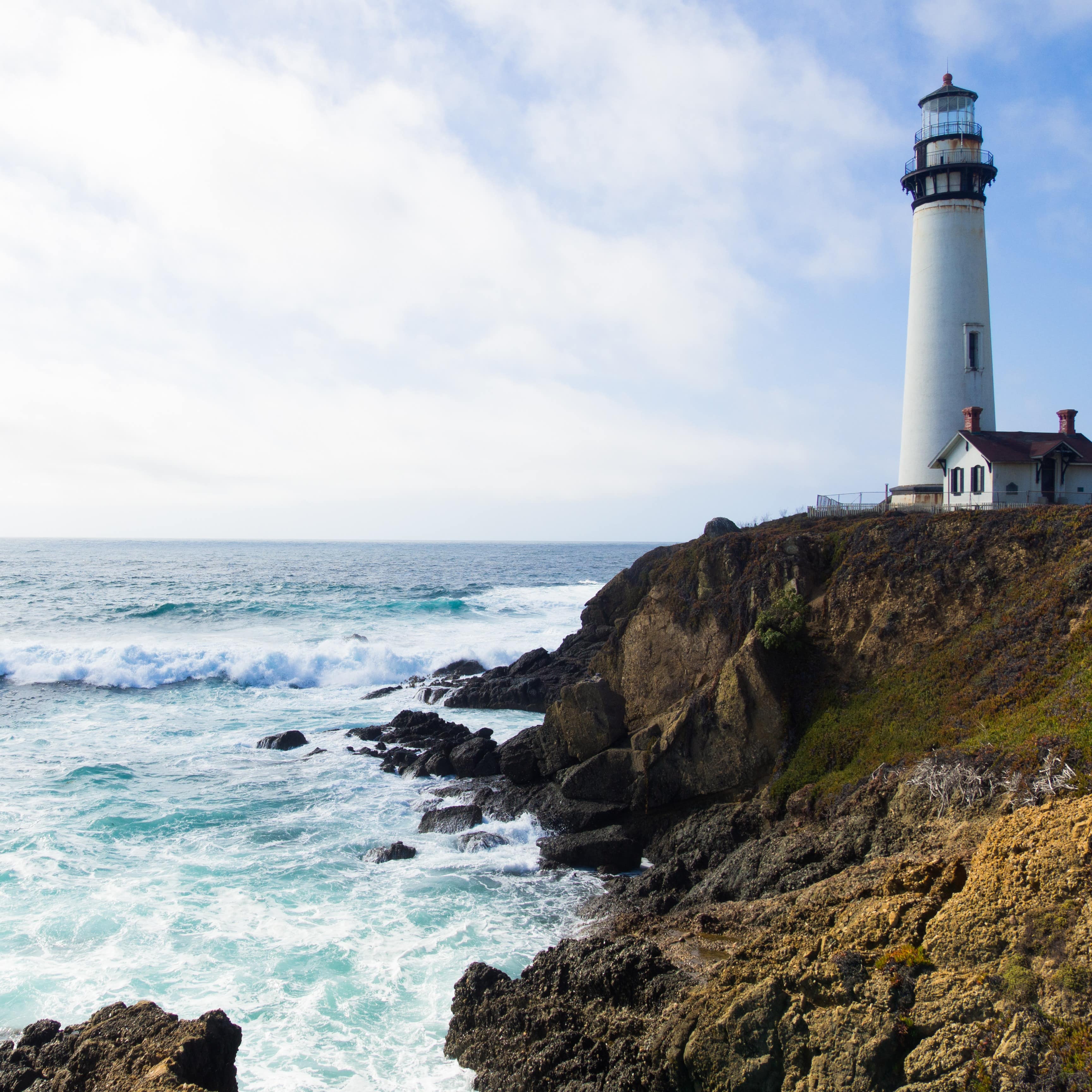 A lighthouse and wild seas in California